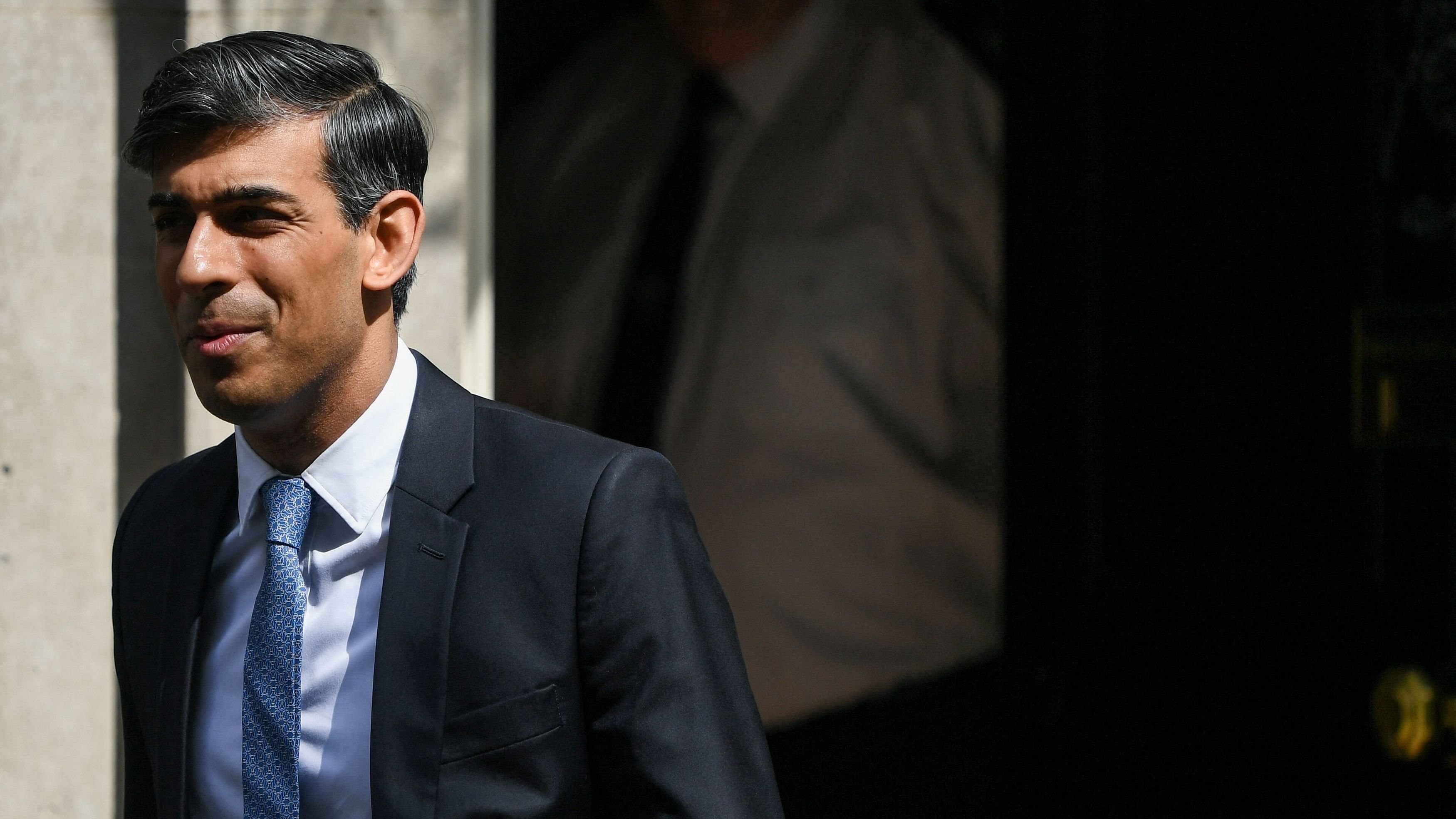 <div class="paragraphs"><p>British Prime Minister Rishi Sunak looks on as he leaves Downing Street.</p></div>