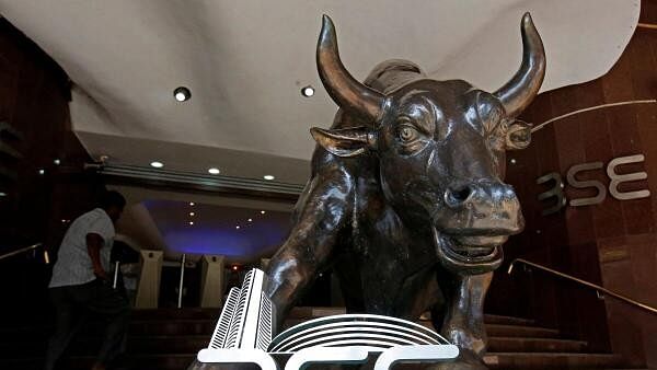 <div class="paragraphs"><p>The Bombay Stock Exchange (BSE) logo is seen under a bull statue at the entrance of their building in Mumbai.</p></div>