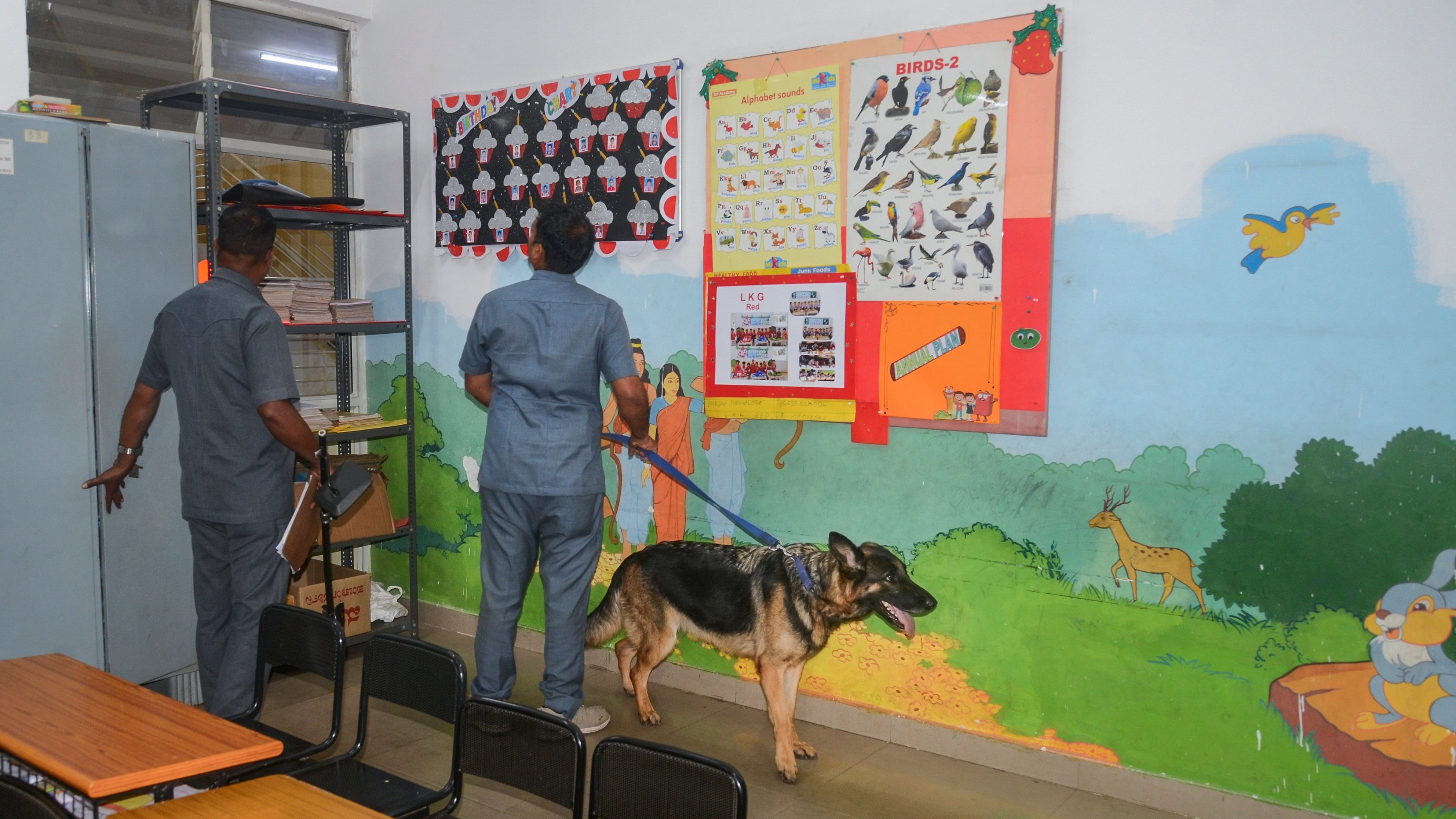 <div class="paragraphs"><p>Members of the police dog squad search the premises of a Bengaluru school. Representative image.</p></div>