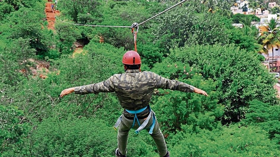 A man enjoys zipline adventure.