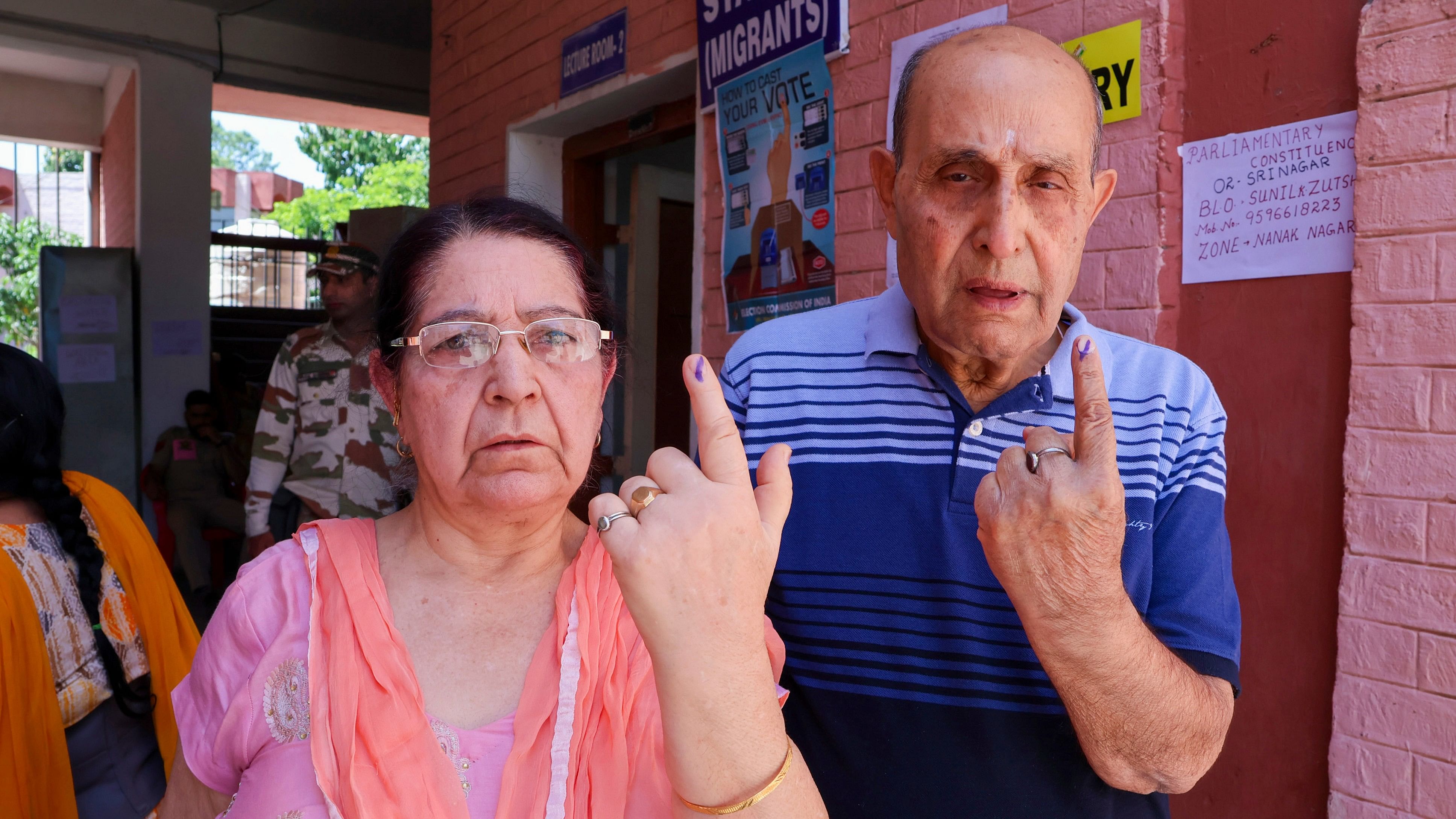 <div class="paragraphs"><p>People from the Kashmiri Pandit community show their inked fingers after casting their votes during the fourth phase of Lok Sabha elections, in Jammu district, Monday.</p></div>