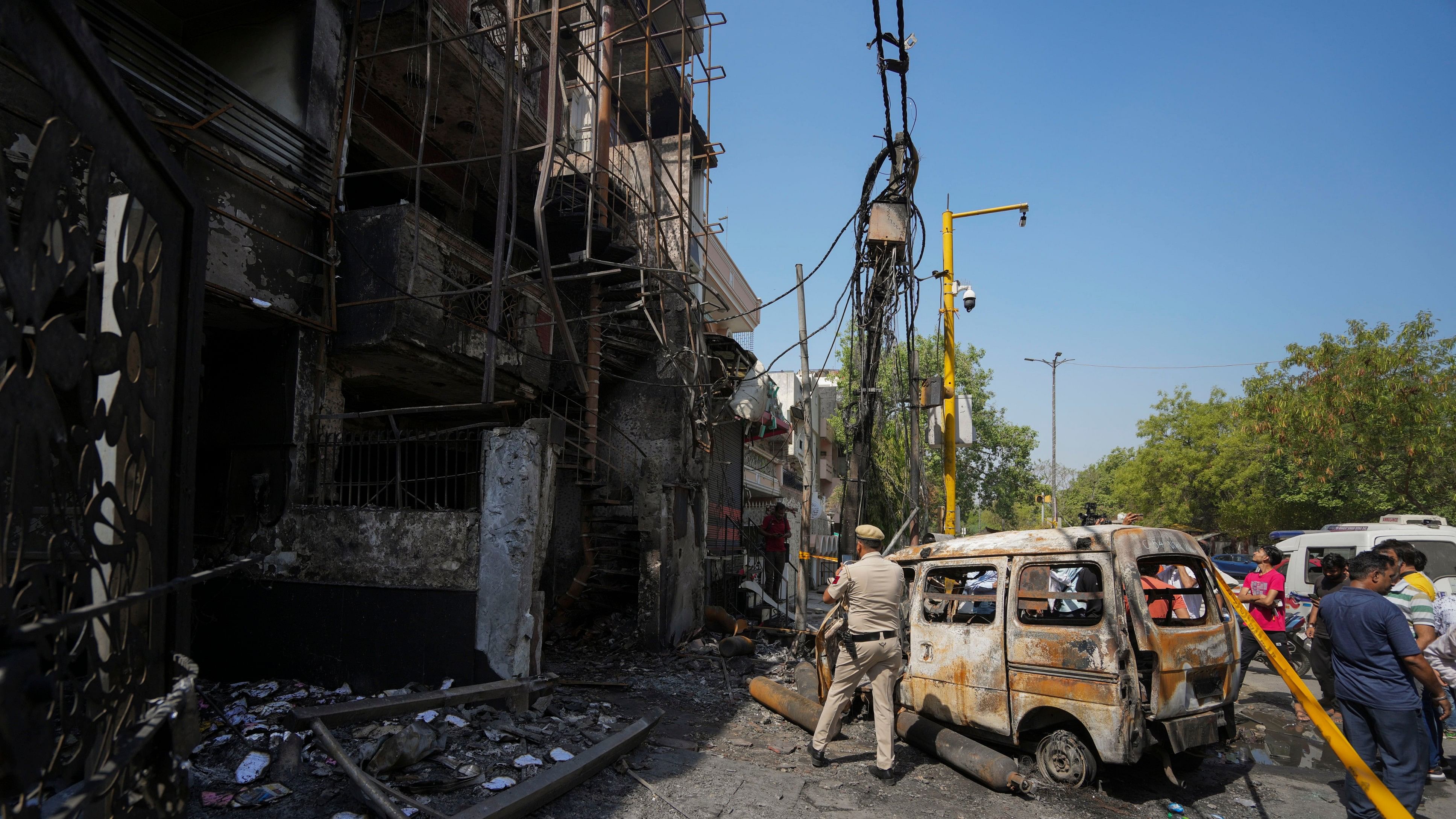 <div class="paragraphs"><p>A policeman stands guard outside a children's hospital where a fire broke out on Saturday night at Vivek Vihar area, in New Delhi, Sunday, May 26, 2024. Seven newborns, who were rescued after the fire, have died, officials said on Sunday.</p></div>