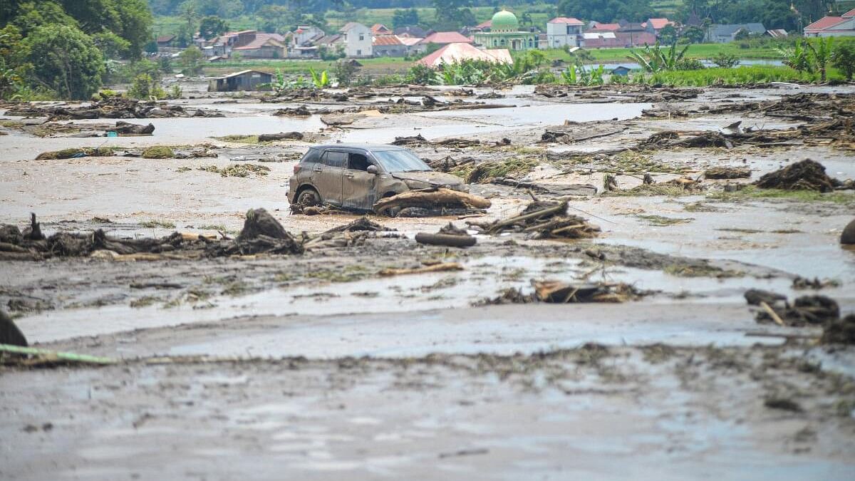 <div class="paragraphs"><p>A damaged car is seen in an area affected by heavy rain brought flash floods and landslides in Agam, West Sumatra province, Indonesia.</p></div>