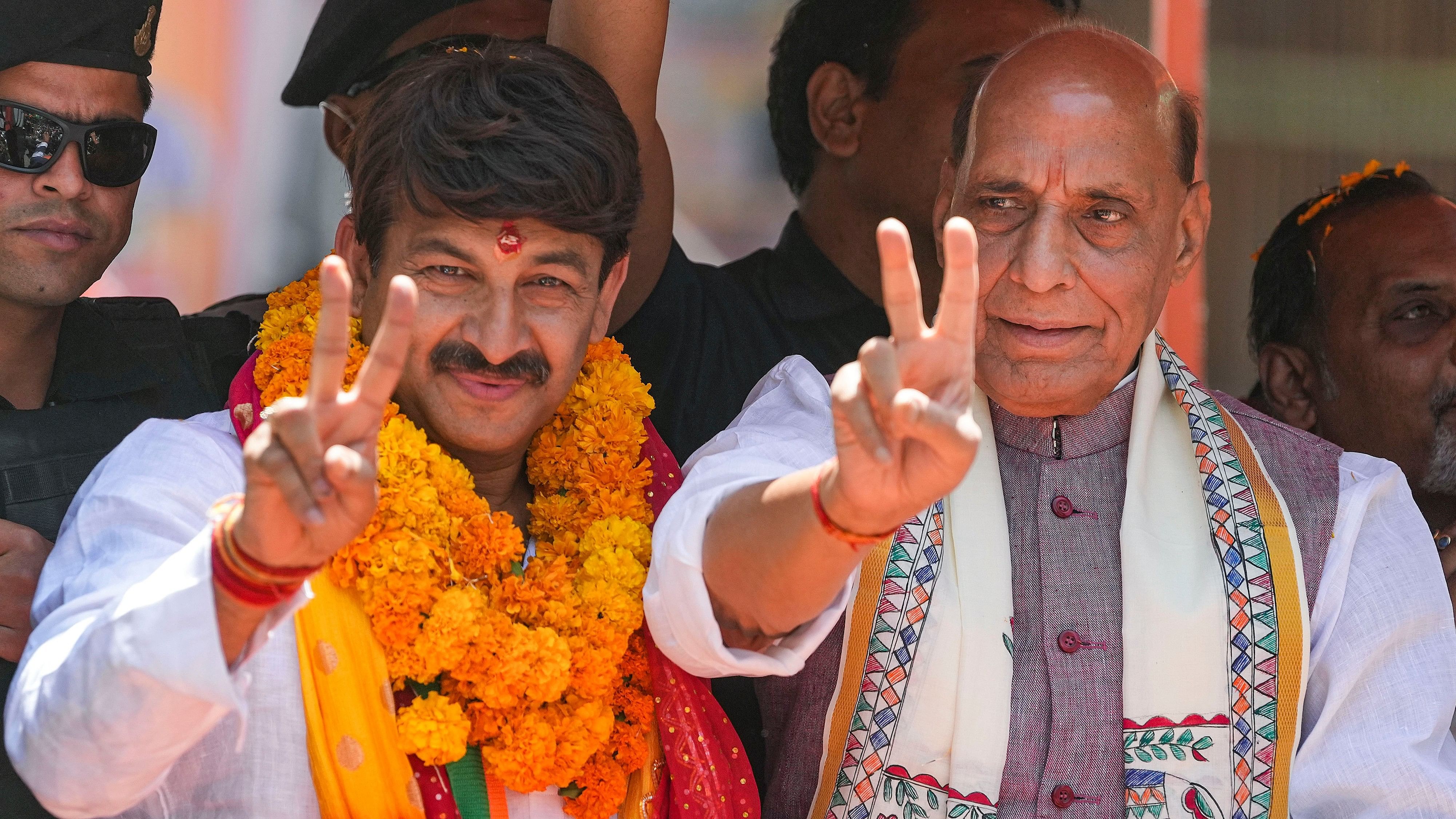 <div class="paragraphs"><p>BJP Delhi North East candidate Manoj Tiwari with Union Defence Minister Rajnath Singh on his way to file his nomination papers for the Lok Sabha elections, in New Delhi, Wednesday, May 1, 2024. </p></div>