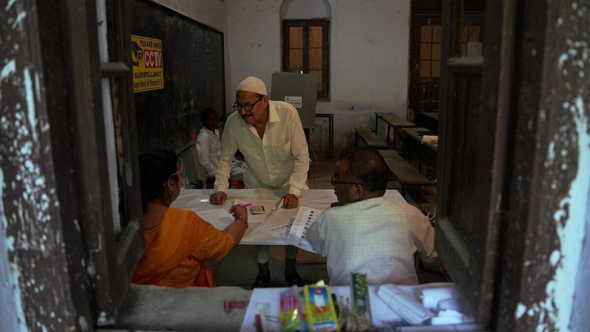 <div class="paragraphs"><p> A man arrives at a polling station to cast their vote during the fourth phase of Lok Sabha elections, in Kanpur, Monday, May 13, 2024. Polling is underway in Uttar Pradesh's 13 seats in fourth phase of Lok Sabha polls.</p></div>