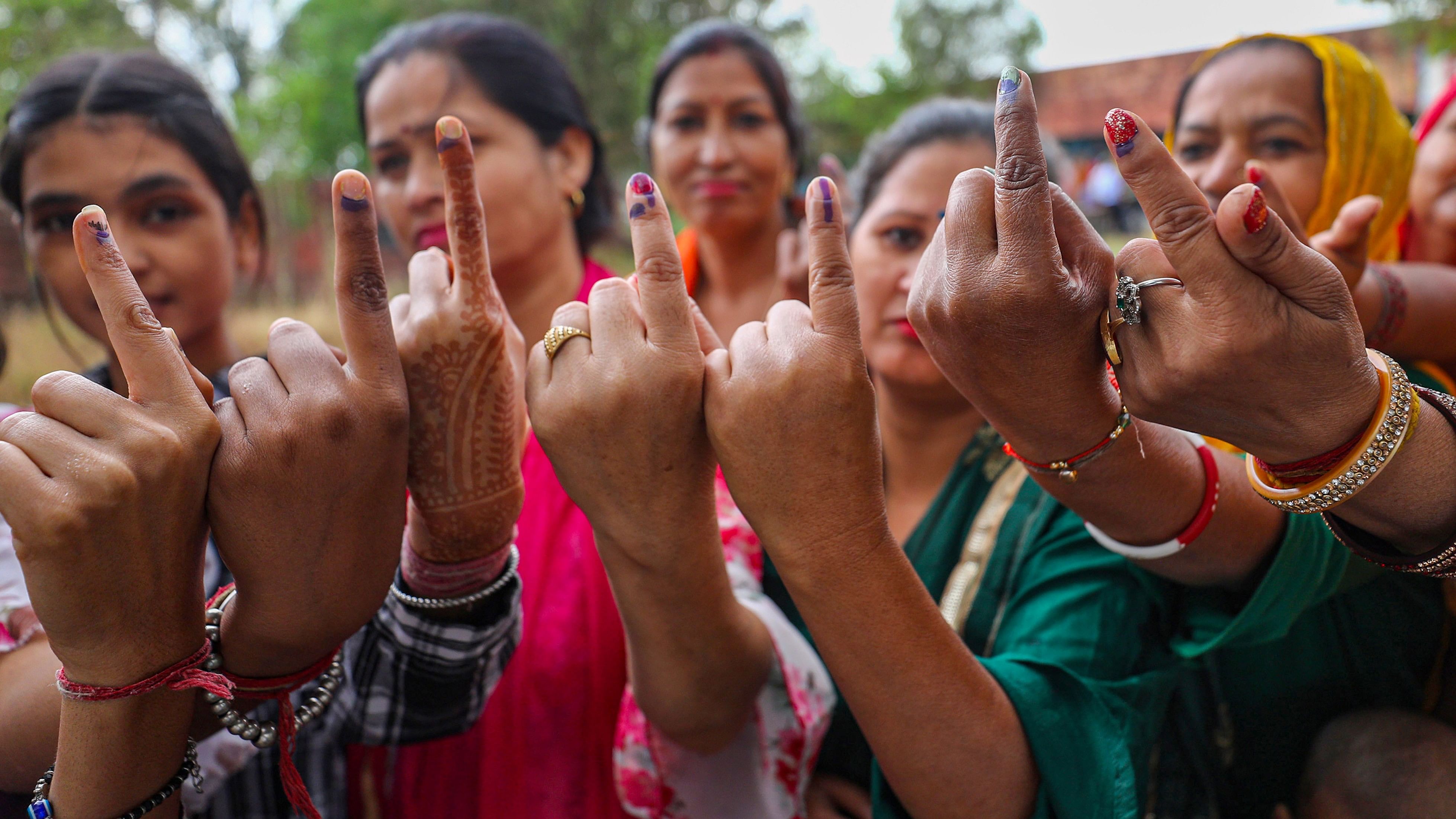 <div class="paragraphs"><p>Women Voter show their ink marked fingers after casting votes at a polling station during the first phase of Lok Sabha polls, in Kathua district.</p></div>