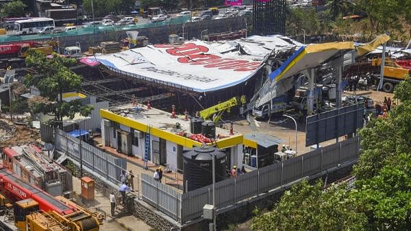 <div class="paragraphs"><p>Rescue and relief work under way near the site of the hoarding collapse at Ghatkopar, in Mumbai, Tuesday, May 14, 2024. At least 14 persons were killed and 76 others injured on Monday night when a 100-foot tall illegal billboard fell on a petrol pump in Ghatkopar area of Mumbai.</p></div>