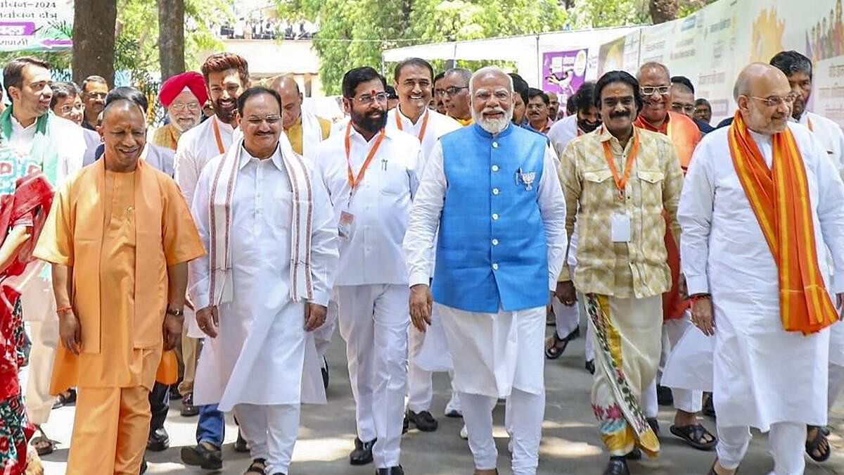 <div class="paragraphs"><p>Prime Minister and senior BJP leader Narendra Modi with Union Home Minister Amit Shah, UP CM Yogi Adityanath and BJP National President J.P. Nadda leaves after filing his nomination for Lok Sabha elections, in Varanasi, Tuesday, May 14, 2024.</p></div>