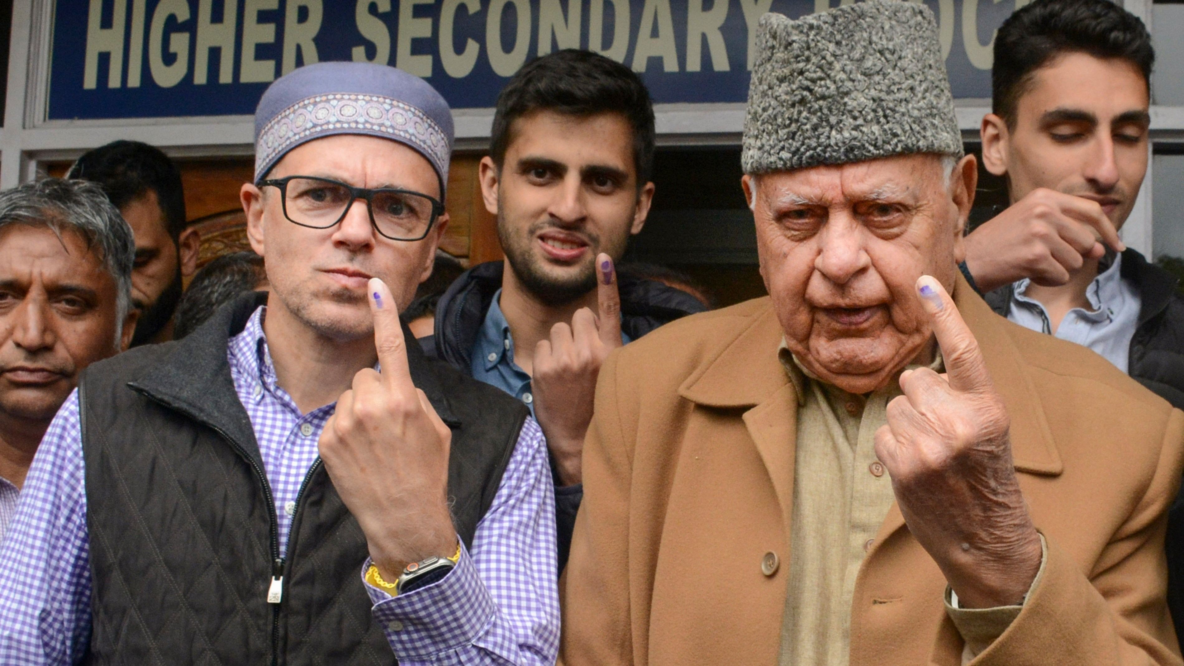 <div class="paragraphs"><p>National Conference President Farooq Abdullah, his son and party Vice President Omar Abdullah and grandsons Zamir Abdullah and Zahir Abdullah show their ink marked fingers after casting their votes at a polling booth during the 4th phase of Lok Sabha elections, in Srinagar.</p></div>