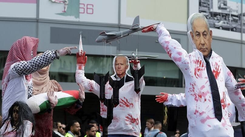 <div class="paragraphs"><p>Masks depicting Israeli Prime Minister Benjamin Netanyahu, U.S. President Joe Biden  are on a stage set by protesters during a pro-Palestinian demonstration.</p></div>