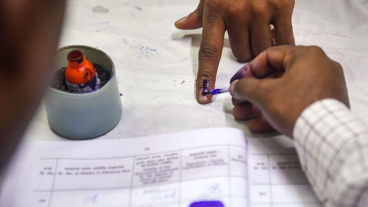 <div class="paragraphs"><p>Representative image showing a person getting his finger inked after casting his vote.</p></div>