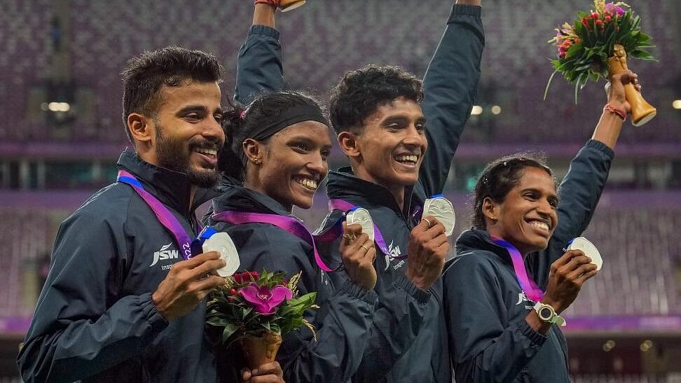 <div class="paragraphs"><p>India's Muhammed Ajmal Variyathodi (L), Subha Venkatesan (CL), Vithya Ramraj (CR) and Rajesh Ramesh (R) posing for photos during the presentation ceremony of 4x400 Relay Mixed final event at the 19th Asian Games.</p></div>