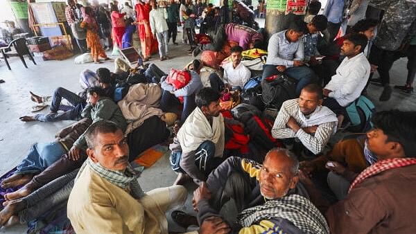 <div class="paragraphs"><p>Stranded passengers at a bus depot after Jammu-Srinagar National Highway was closed due to landslides in Ramban area, in Jammu, Tuesday, April 30</p></div>