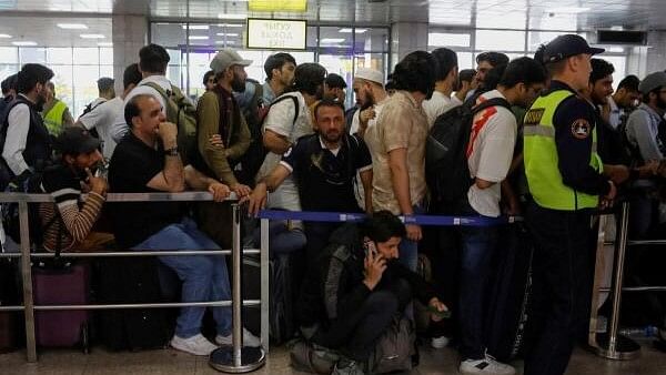 <div class="paragraphs"><p>Pakistani nationals, including students, wait for a repatriation flight, as they leave Kyrgyzstan after a mob recently attacked their living quarters, at the airport outside Bishkek, Kyrgyzstan, May 23, 2024.</p></div>