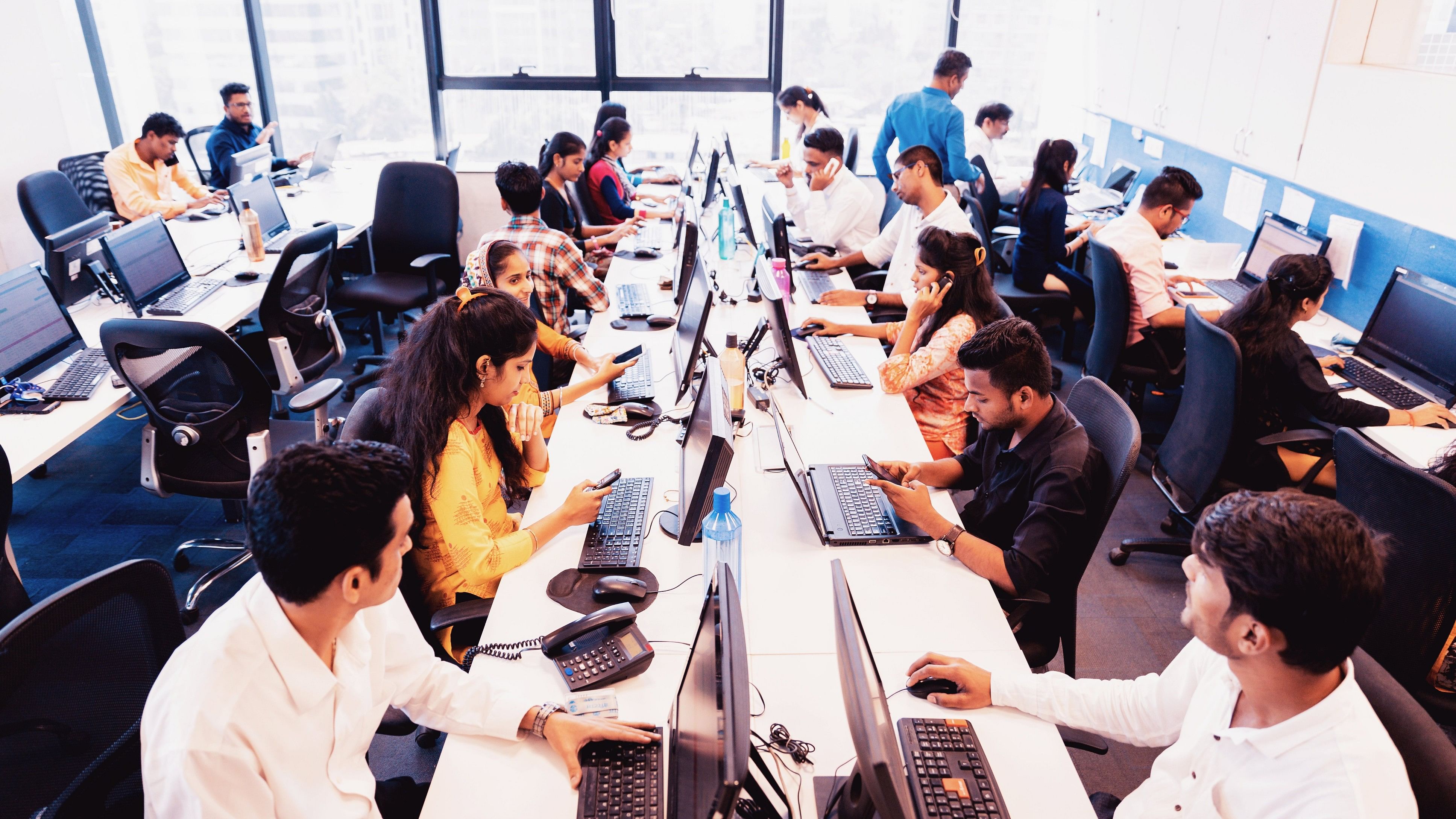 <div class="paragraphs"><p>Group of customer service executives attending calls at a busy call centre. (Representative image)</p></div>