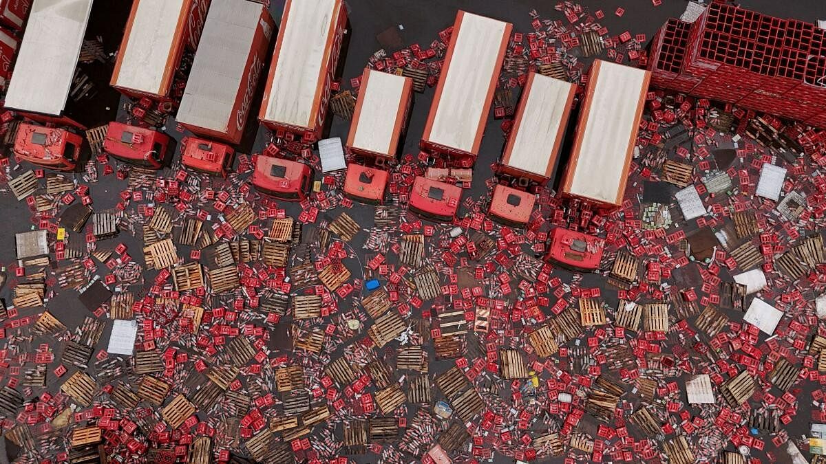 <div class="paragraphs"><p>A drone view shows Coca-Cola FEMSA boxes and bottles floating in the water near trucks, amid flooding in Porto Alegre, Rio Grande do Sul state, Brazil, May 19, 2024. </p></div>