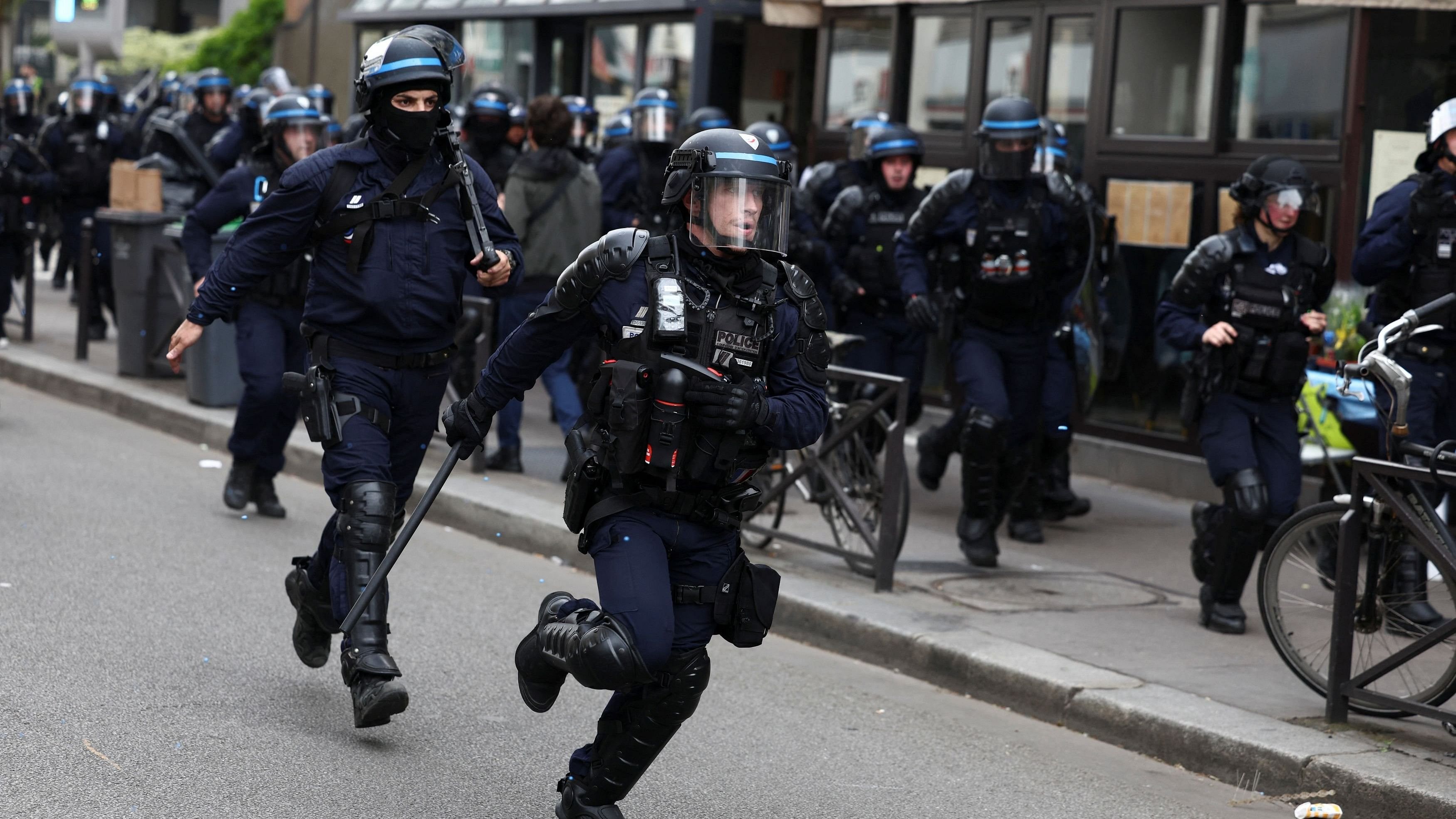 <div class="paragraphs"><p>French CRS riot police officers stand on position as demonstrators march amid clashes during the traditional May Day labour union march in Paris, France, May 1, 2024. </p></div>