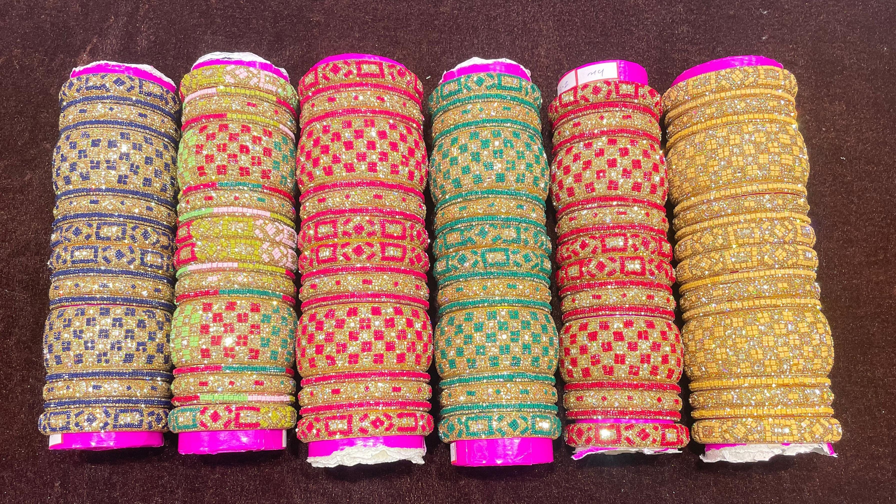A series of vibrant bridal lac bangle sets with geometrical patterns at Safa Bangles and Jewellers.