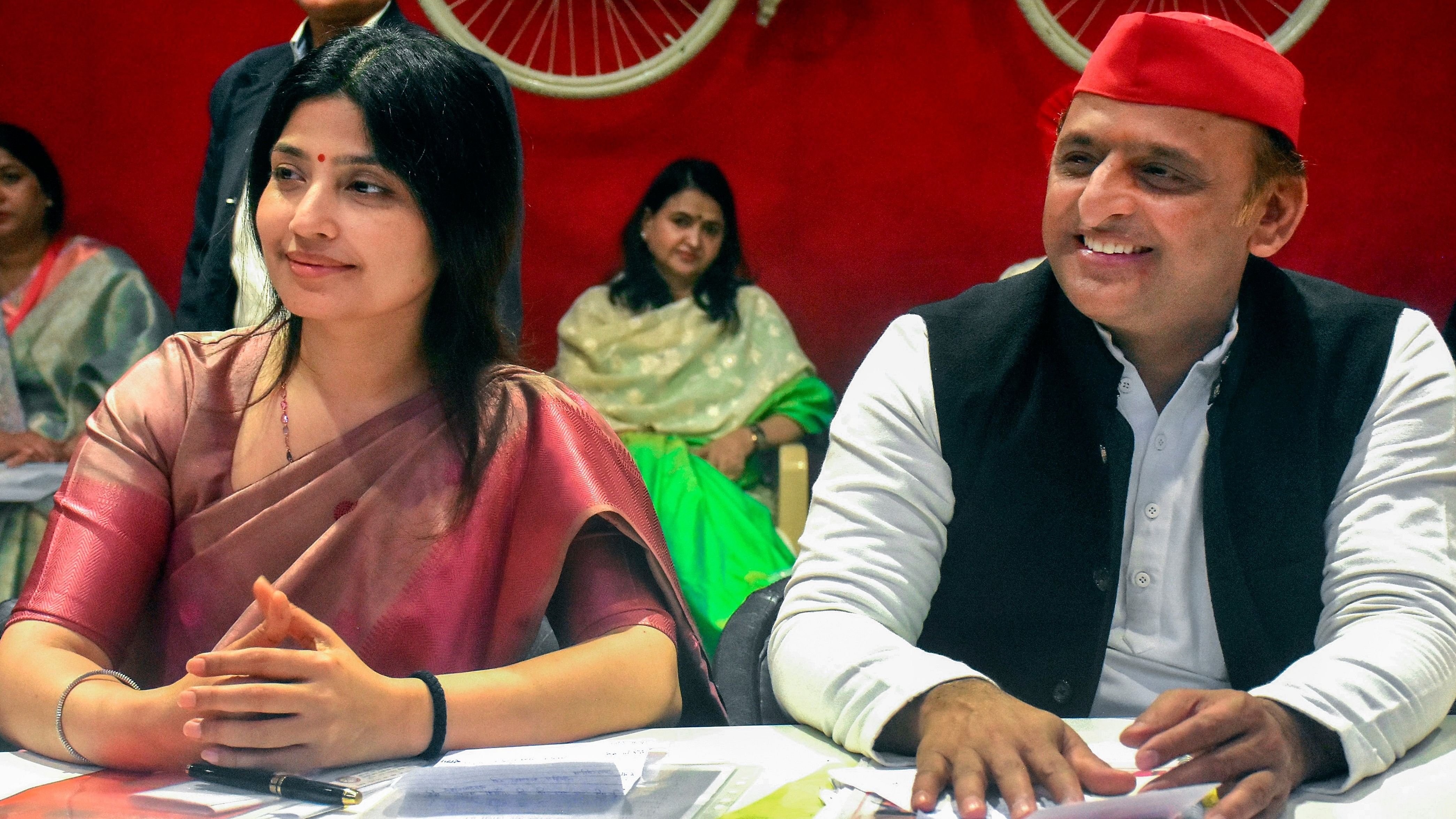 <div class="paragraphs"><p>Samajwadi Party President Akhilesh Yadav with his wife and party leader Dimple Yadav.</p></div>