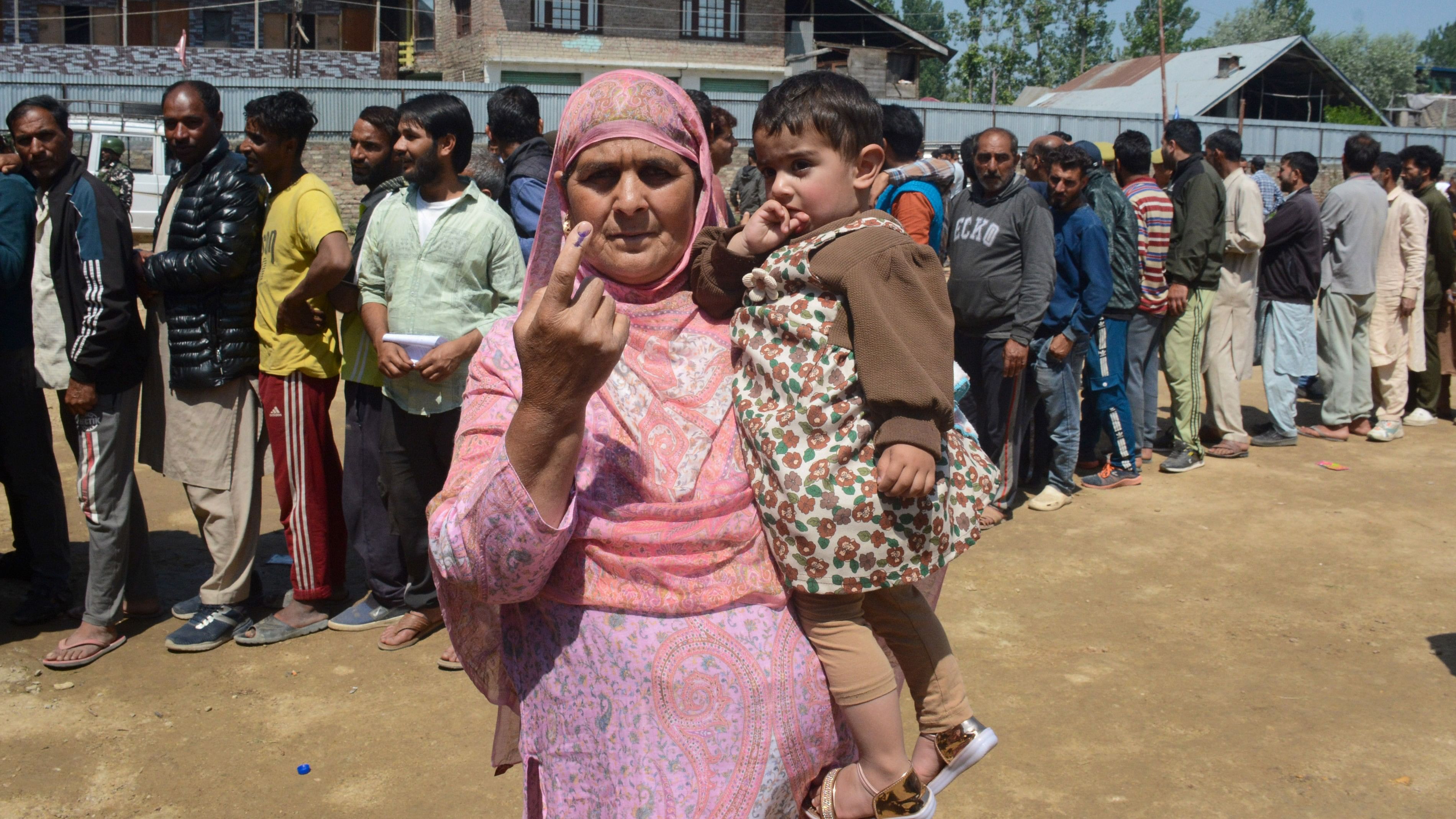 <div class="paragraphs"><p>An elderly voter shows her ink marked finger after casting her vote at a polling booth during the 5th phase of elections, in Baramulla district of north Kashmir, on Monday.</p></div>