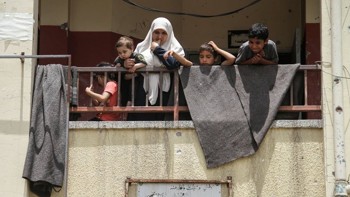 <div class="paragraphs"><p>Palestinians inspect the site of an Israeli strike on a school sheltering displaced people, amid the ongoing conflict between Israel and the Palestinian Islamist group Hamas, in Gaza City.</p></div>