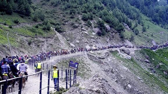 <div class="paragraphs"><p>Pilgrims enroute to the holy cave shrine of Amarnath from the Baltal base camp during the annual Amarnath Yatra, in Ganderbal district, Saturday.&nbsp;</p></div>