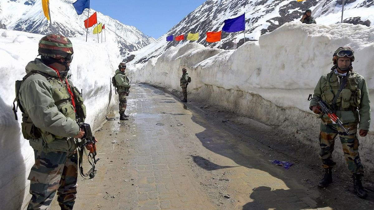 <div class="paragraphs"><p>Representative image showing army soldiers standing guard at snow-bound Zojila Pass, situated at a height of 11,516 feet, on its way to frontier region of Ladakh.</p></div>