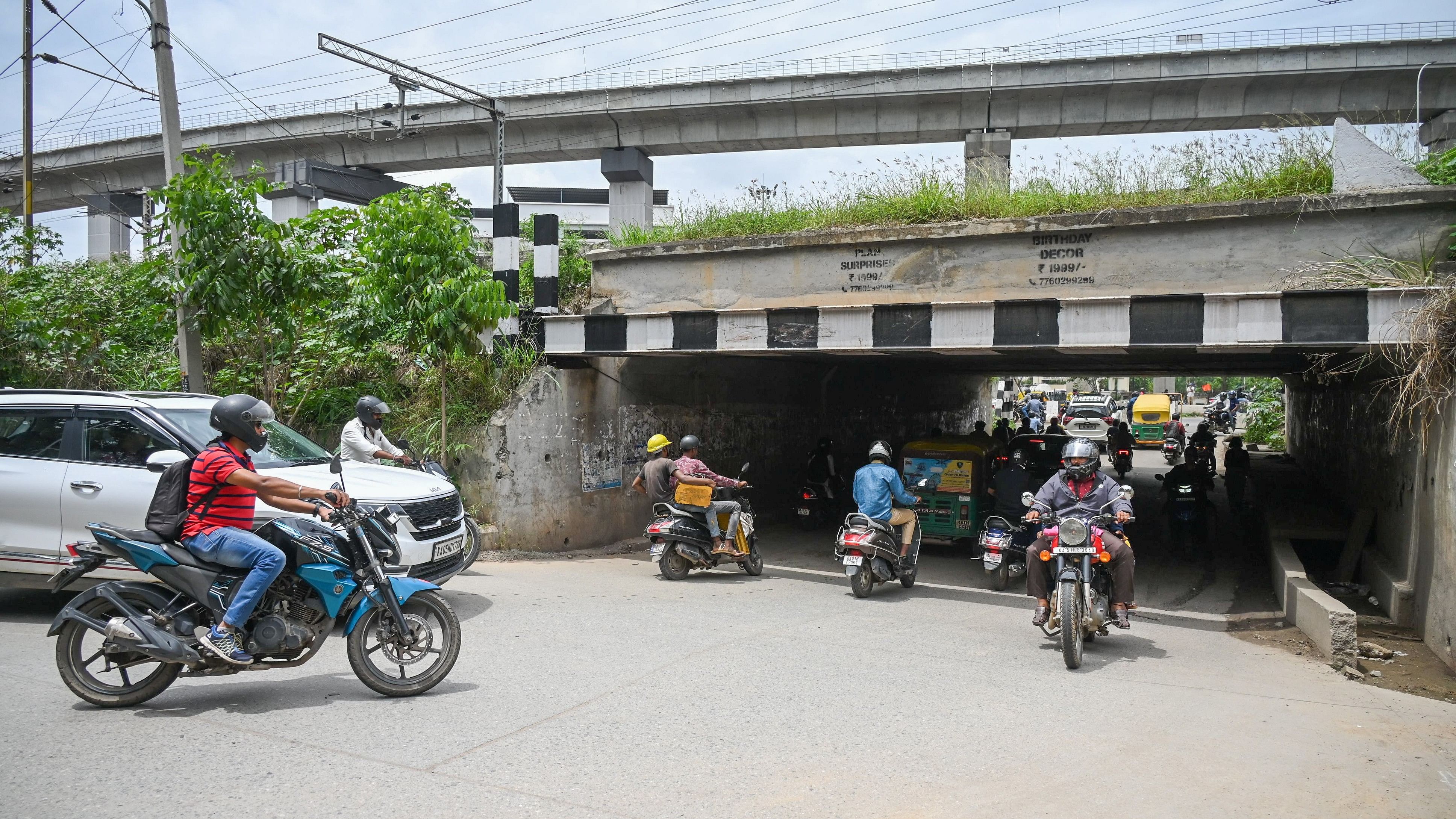 <div class="paragraphs"><p>Vehicles continue to navigate through this narrow underpass at KR Puram.&nbsp;</p></div>