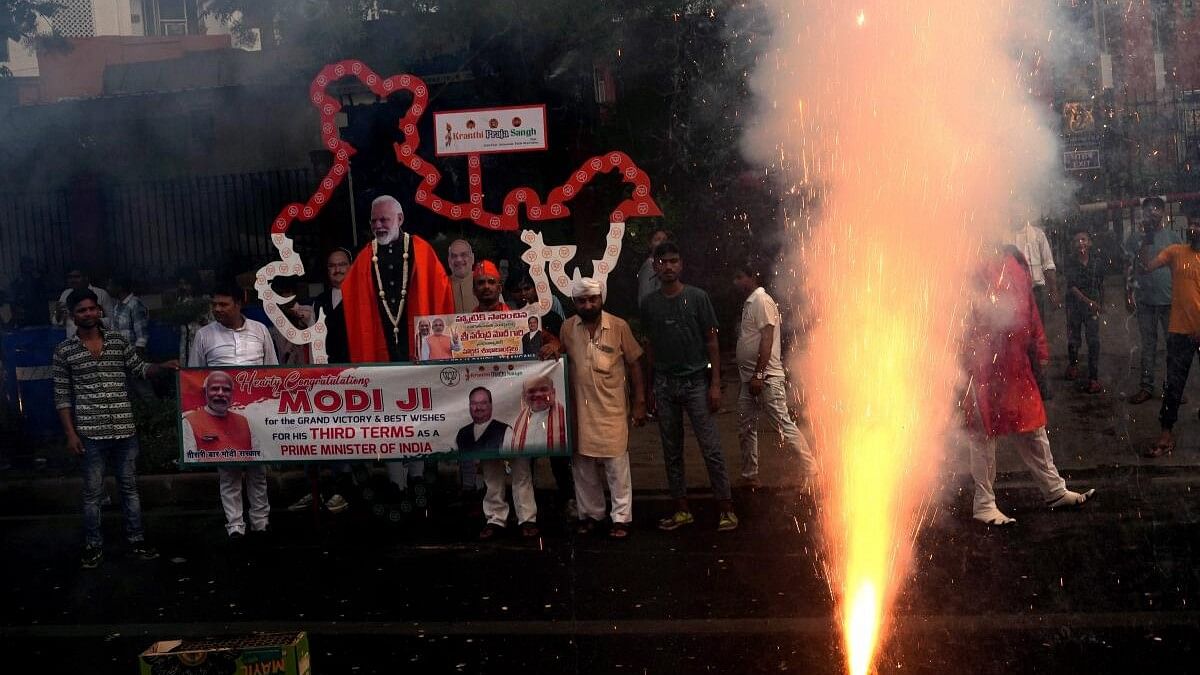 <div class="paragraphs"><p>Supporters celebrate during the arrival of Prime Minister Narendra Modi for a meeting at BJP headquarters.&nbsp;</p></div>