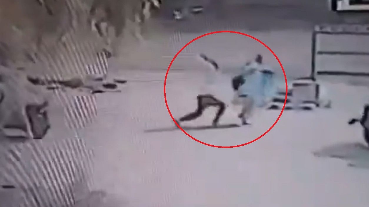 <div class="paragraphs"><p>Screengrab of CCTV footage where the assailant and the victim are circled in red</p></div>