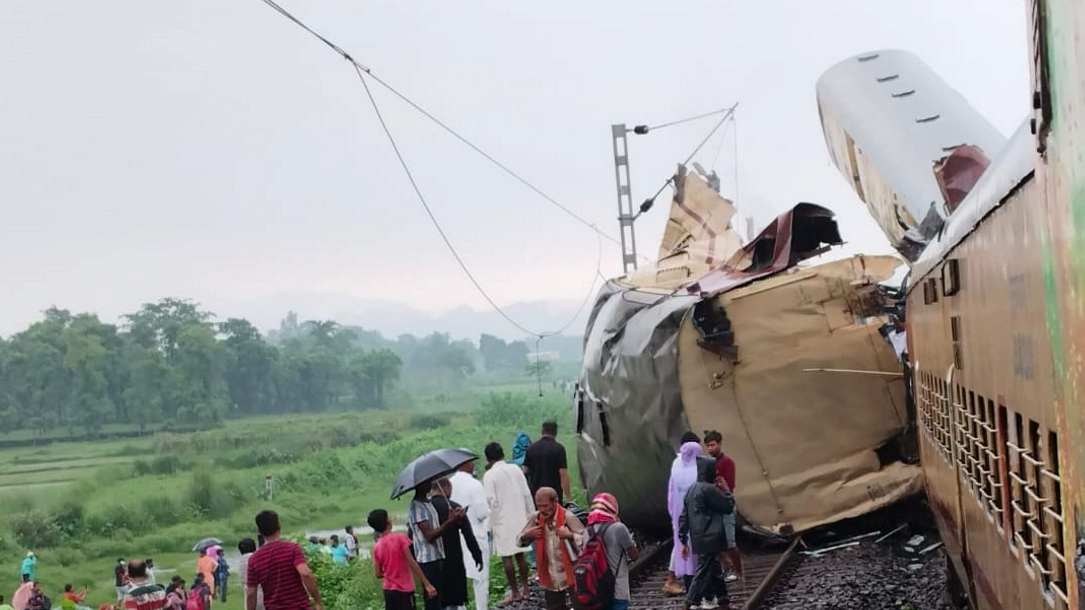 <div class="paragraphs"><p>Locals gather after a collision between the Kanchanjungha Express and a goods train, near Rangapani railway station, on Monday, June 17, 2024.</p></div>