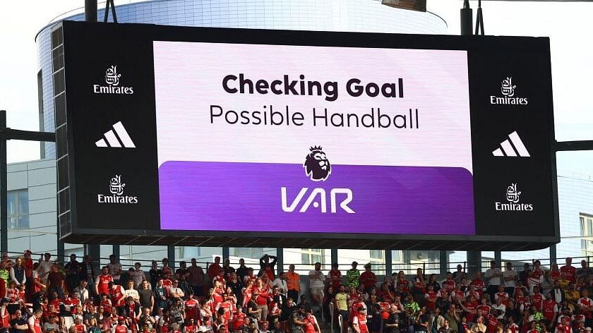 <div class="paragraphs"><p>A big screen in the Emirates Stadium displays a VAR review message.</p></div>