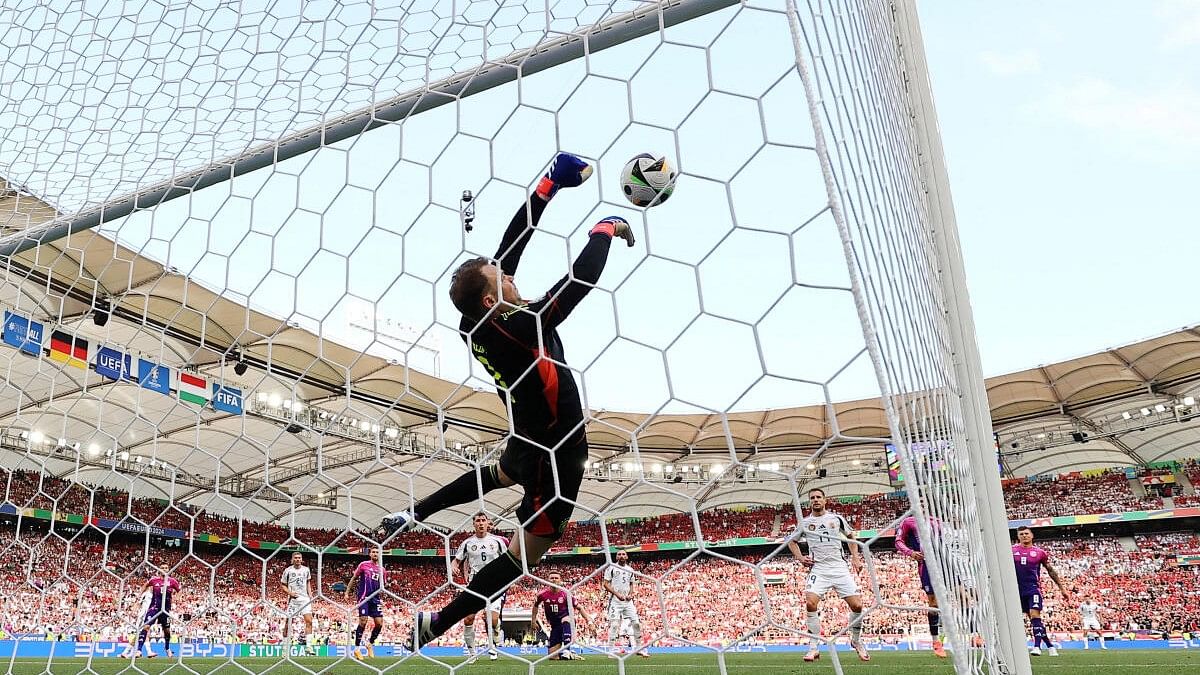 <div class="paragraphs"><p>Hungary's Dominik Szoboszlai has his shot from a free kick saved by Germany's Manuel</p></div>