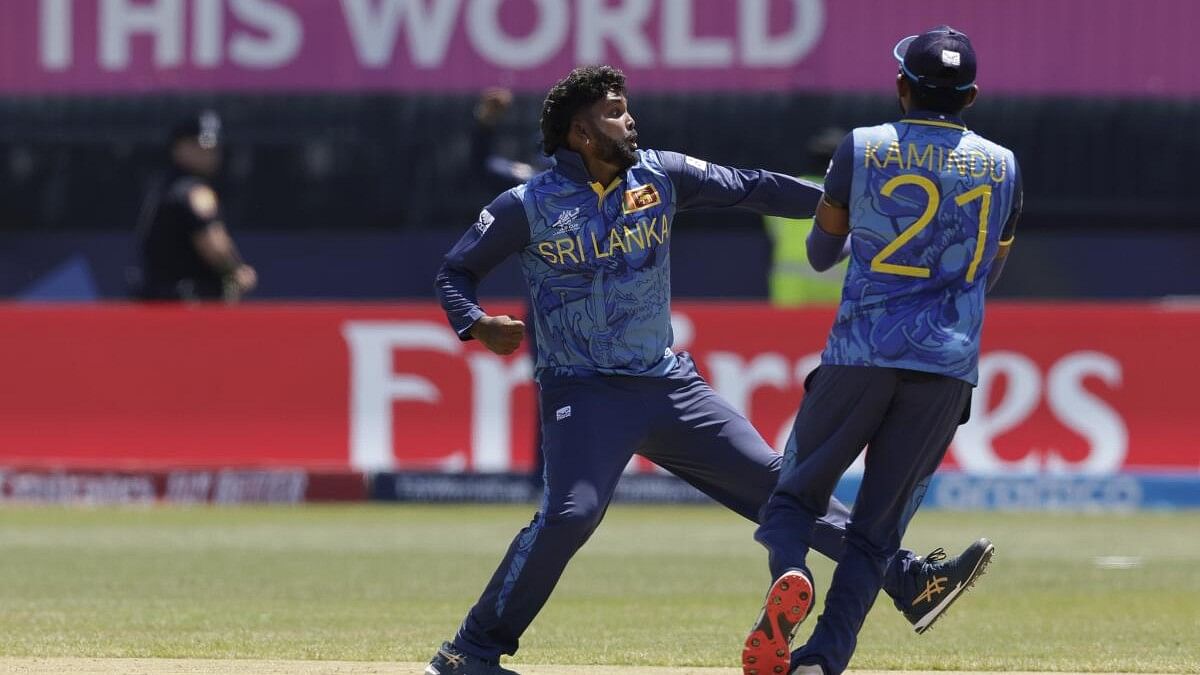 <div class="paragraphs"><p>Sri Lanka's captain Wanindu Hasaranga, left, celebrates the dismissal of South Africa's Quinton de Kock during the ICC Men's T20 World Cup cricket match between South Africa and Sri Lanka at the Nassau County International Cricket Stadium in Westbury, New York, Monday, June 3, 2024.</p></div>