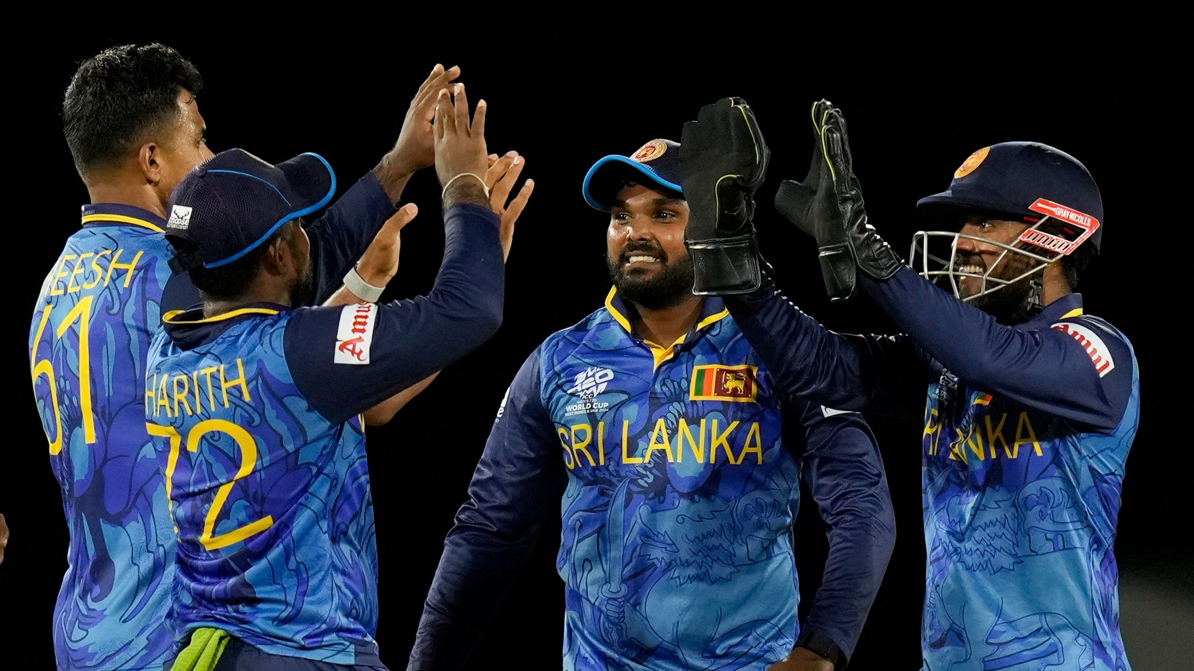 <div class="paragraphs"><p>Sri Lanka's Kusal Mendis right celebrates with teammates after stumping Michael Levitt of the Netherlands during an ICC Men's T20 World Cup cricket match at Daren Sammy National Cricket Stadium in Gros Islet, Saint Lucia, Sunday, June 16, 2024.</p></div>