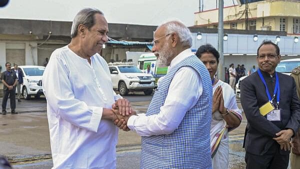 <div class="paragraphs"><p>(L to R) BJD President Naveen Patnaik with PM Narendra Modi.</p></div>