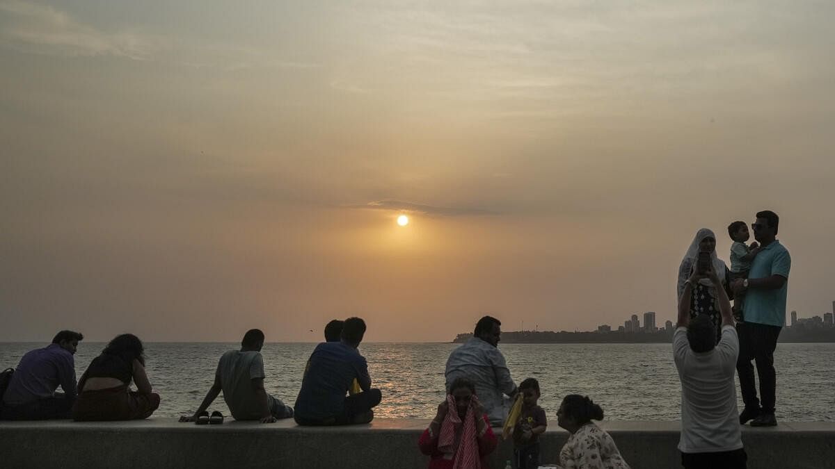 <div class="paragraphs"><p>Visitors at the Marine Drive, in Mumbai, Friday, June 7, 2024. India Meteorological Department (IMD) scientist Sunil Kamble on Thursday said the monsoon has reached Sindhudurg district in south Konkan and Sangli and Kolhapur in western Maharashtra and is likely to reach Mumbai between June 9 and 10.</p></div>