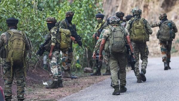 <div class="paragraphs"><p>Army personnel conduct search operation after a bus carrying pilgrims was ambushed by terrorists, in Reasi district of Jammu and Kashmir, Monday, June 10, 2024. At least 9 people were killed and 33 others suffered injuries in the terror attack on the bus, according to officials.</p></div>