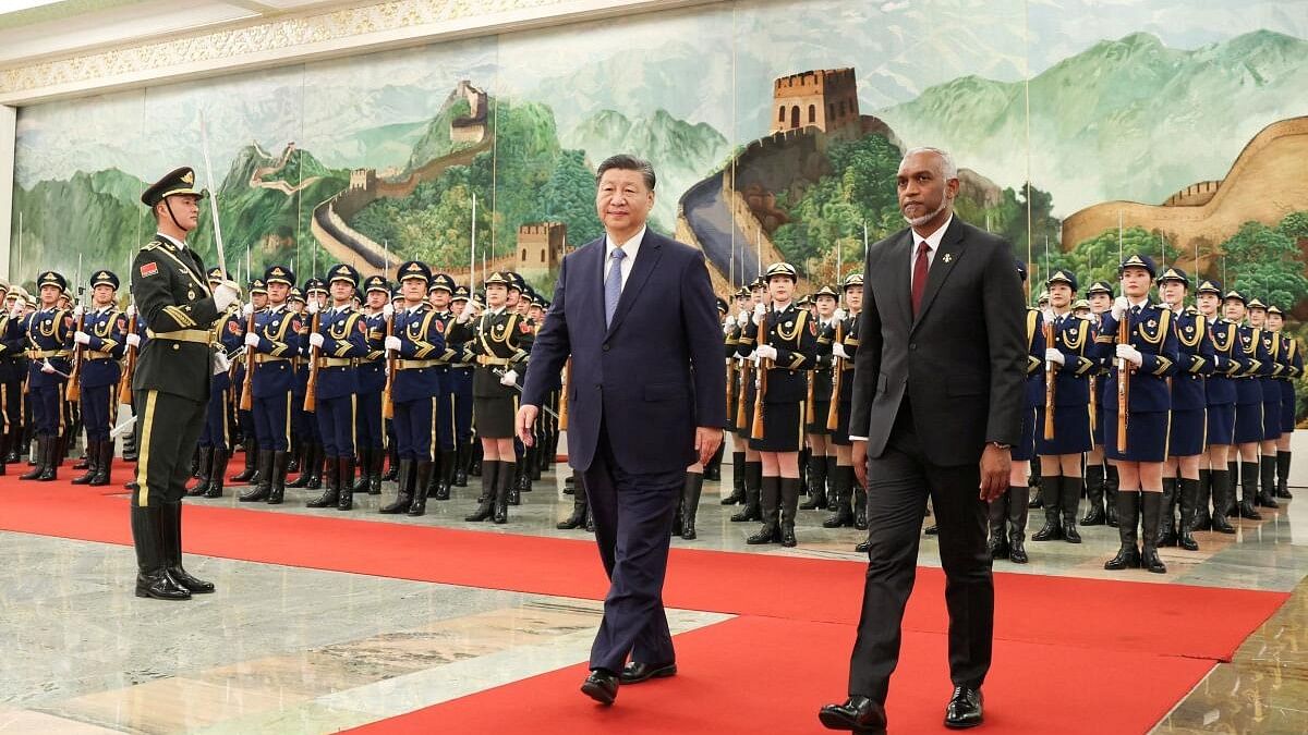 <div class="paragraphs"><p>Chinese President Xi Jinping and Maldivian President Mohamed Muizzu.</p></div>