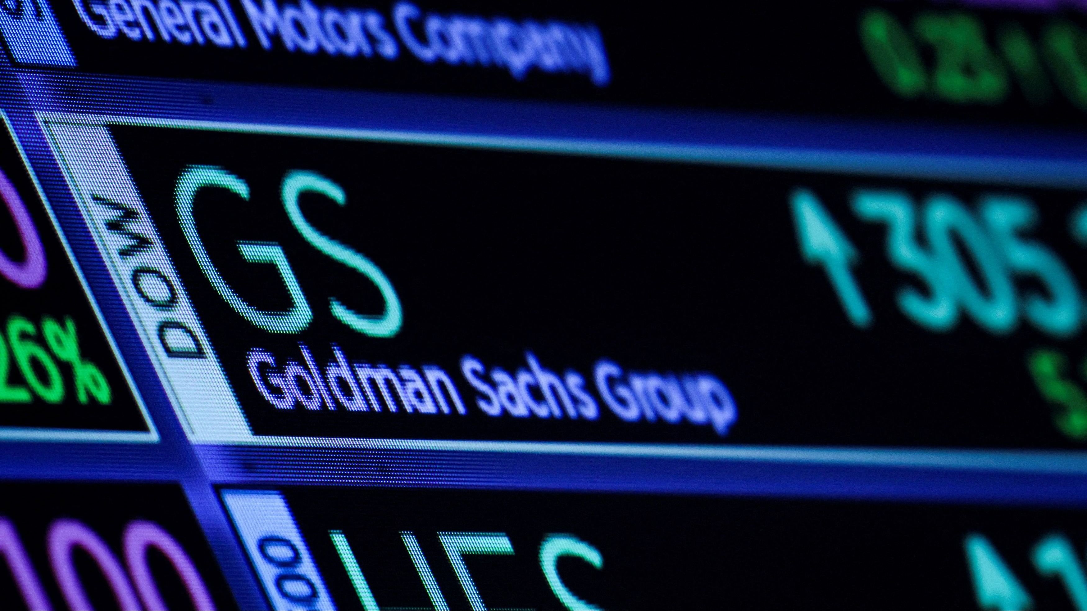 <div class="paragraphs"><p> A screen displays the trading information for Goldman Sachs on the floor of the New York Stock Exchange in New York City.</p></div>