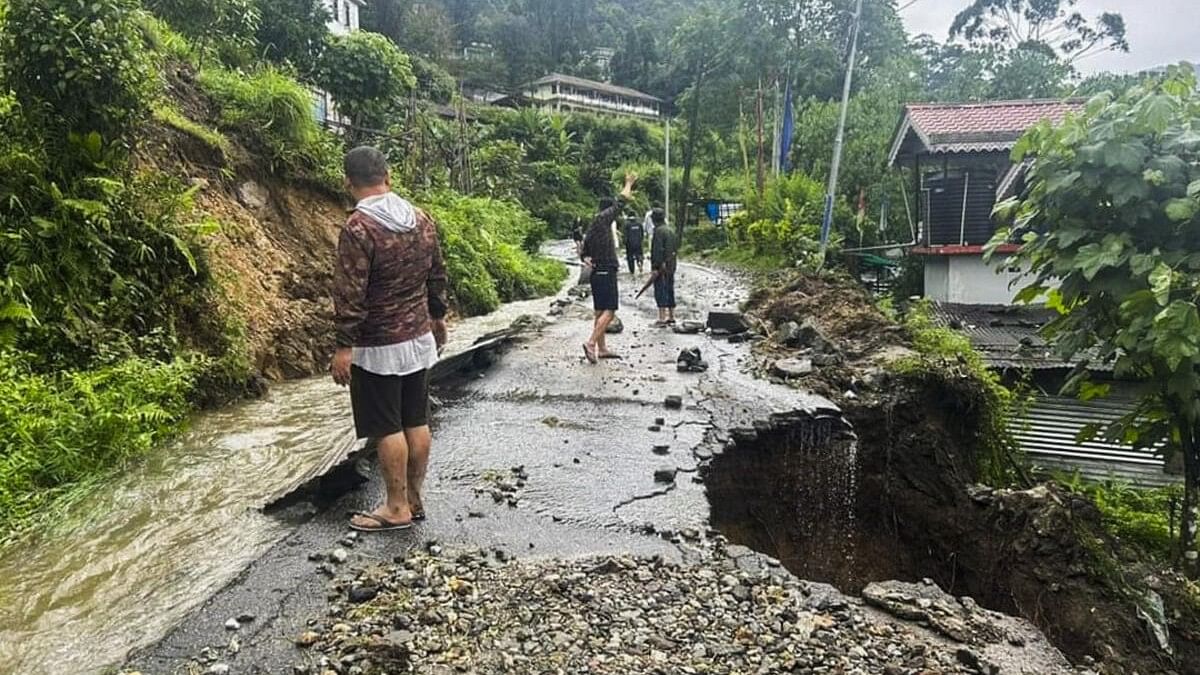 <div class="paragraphs"><p>Section of a road damaged due to landslides triggered by incessant rainfall, at Mangan in North Sikkim, Thursday, June 13, 2024</p></div>