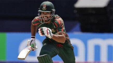 <div class="paragraphs"><p>Bangladesh's captain Najmul Hossain Shanto runs after playing a shot during the ICC Men's T20 World Cup series</p></div>