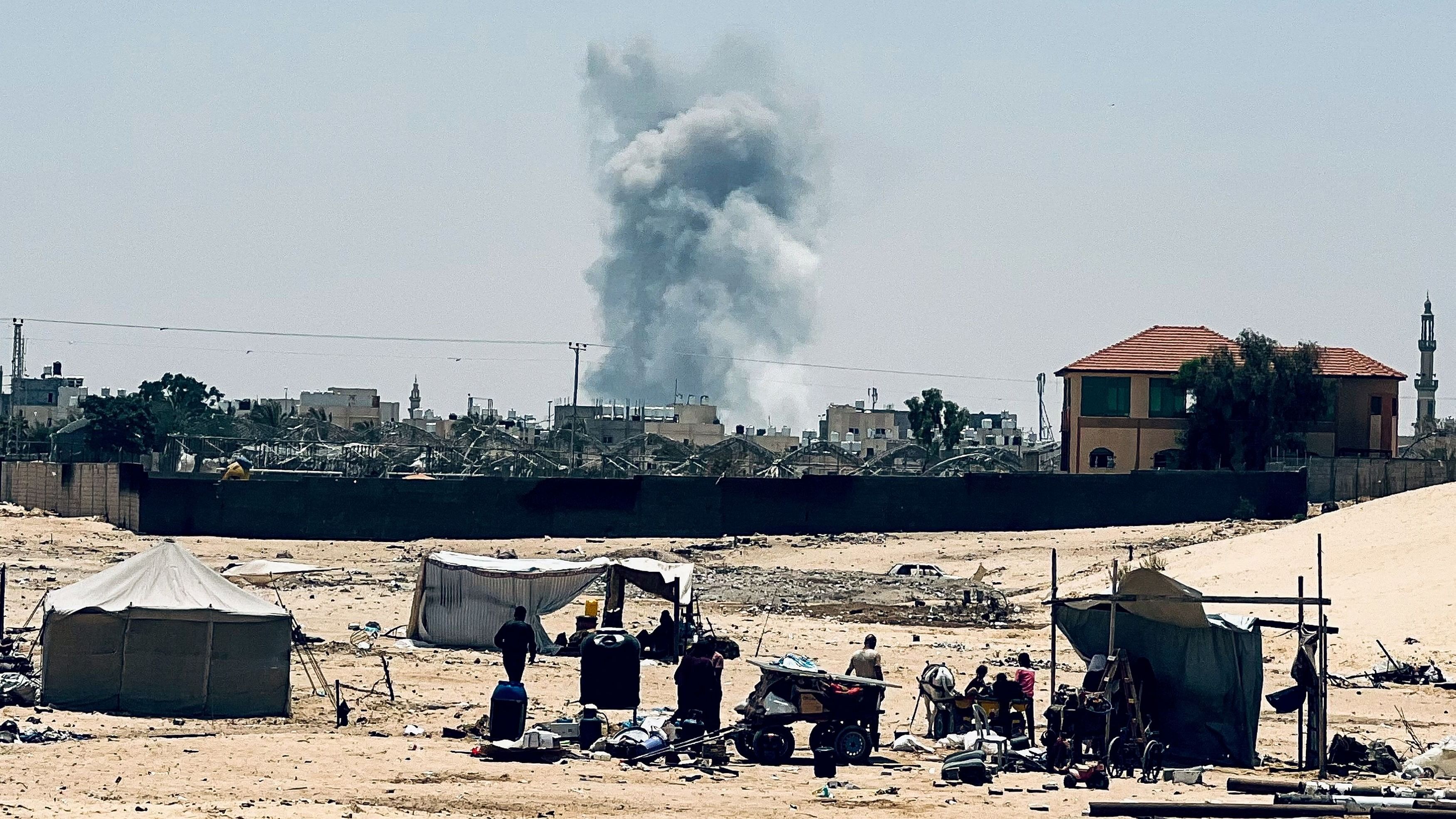 <div class="paragraphs"><p>Smoke rises following Israeli strikes, in Rafah</p></div>