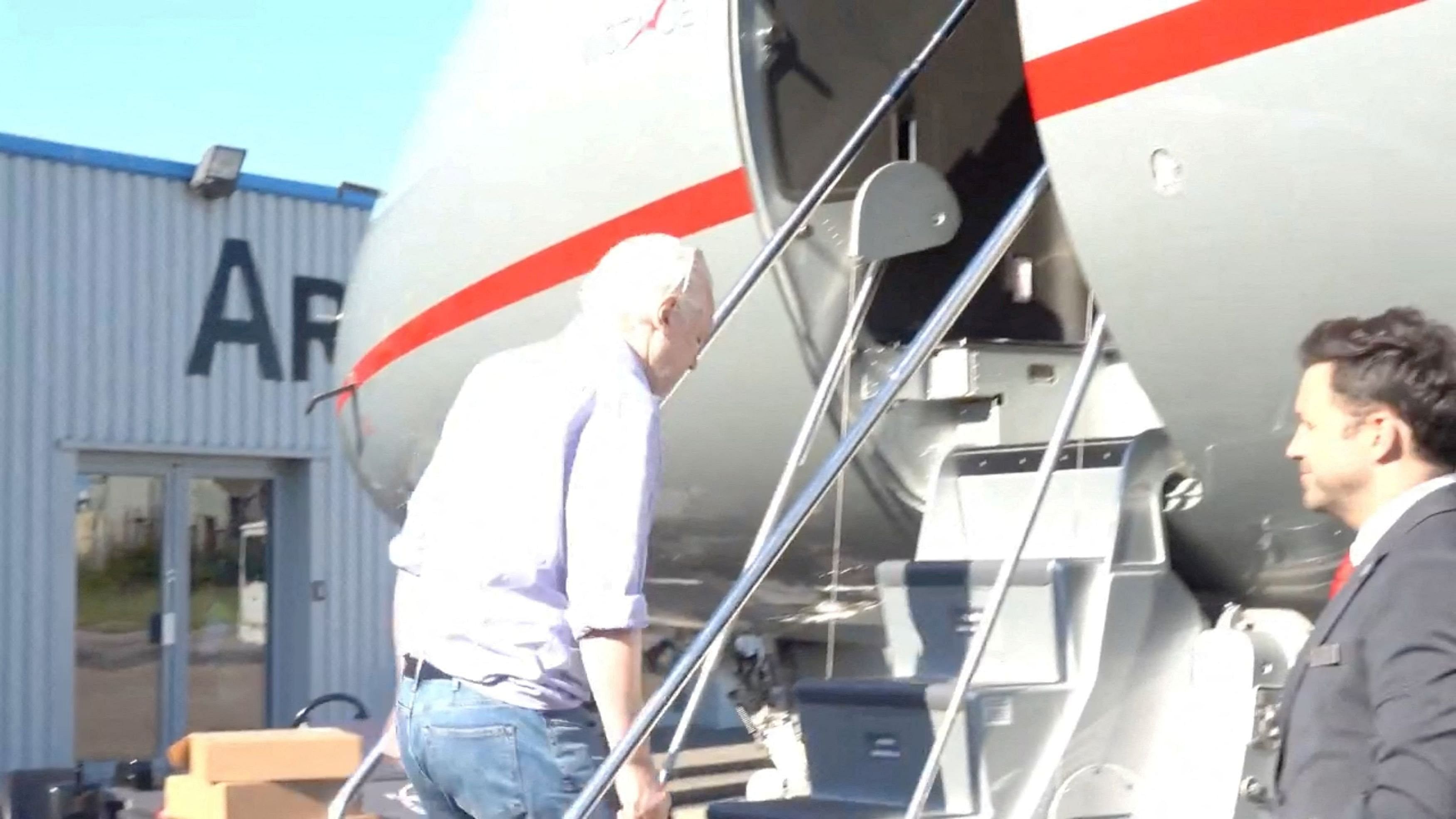 <div class="paragraphs"><p>WikiLeaks founder Julian Assange boards a plane at a location given as London, Britain, in this still image from video released JUNE 25, 2024.  </p></div>