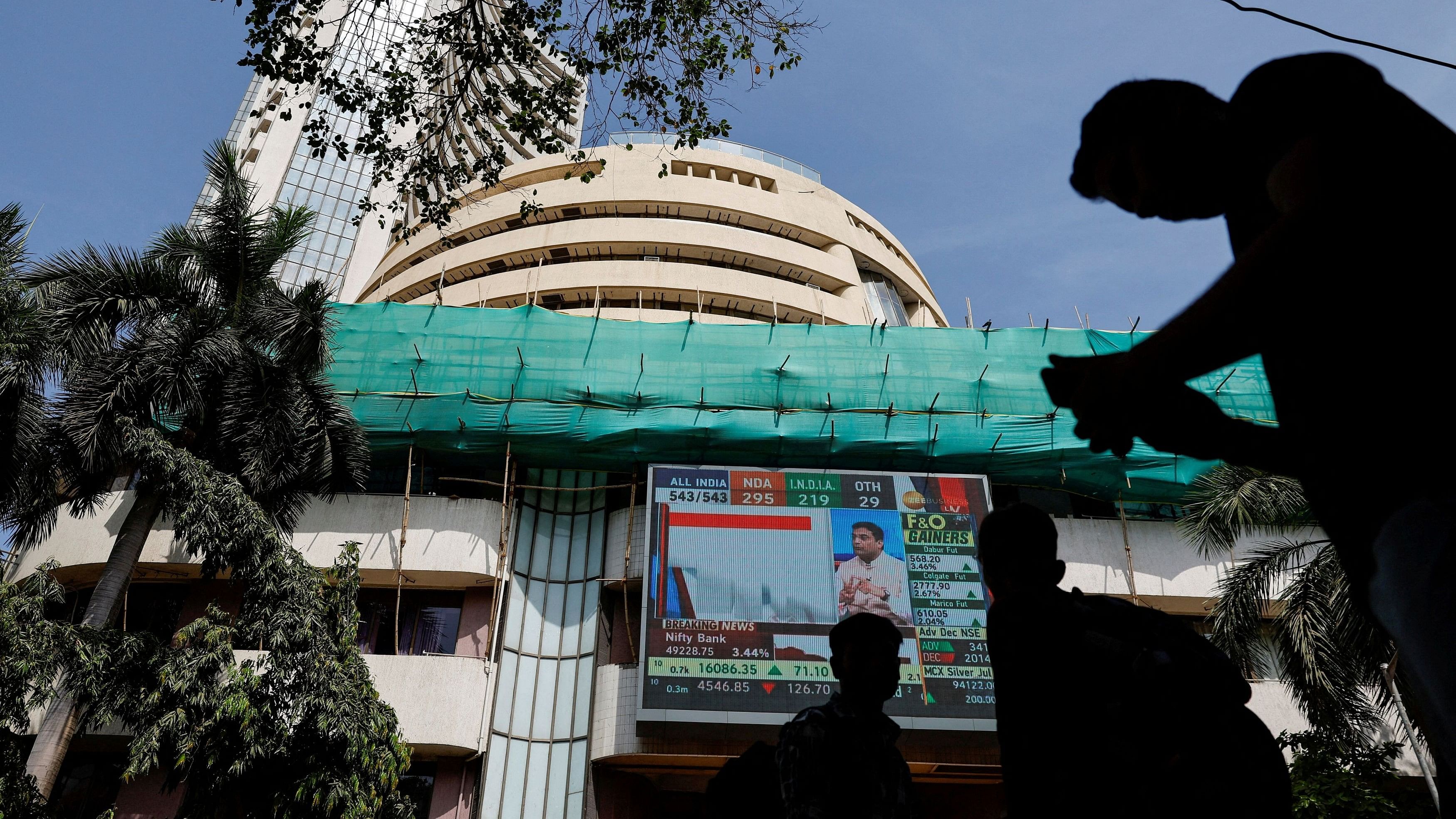 <div class="paragraphs"><p>File Photo: People watch results of the general elections on a screen outside the Bombay Stock Exchange (BSE) in Mumbai, June 4, 2024.</p></div>