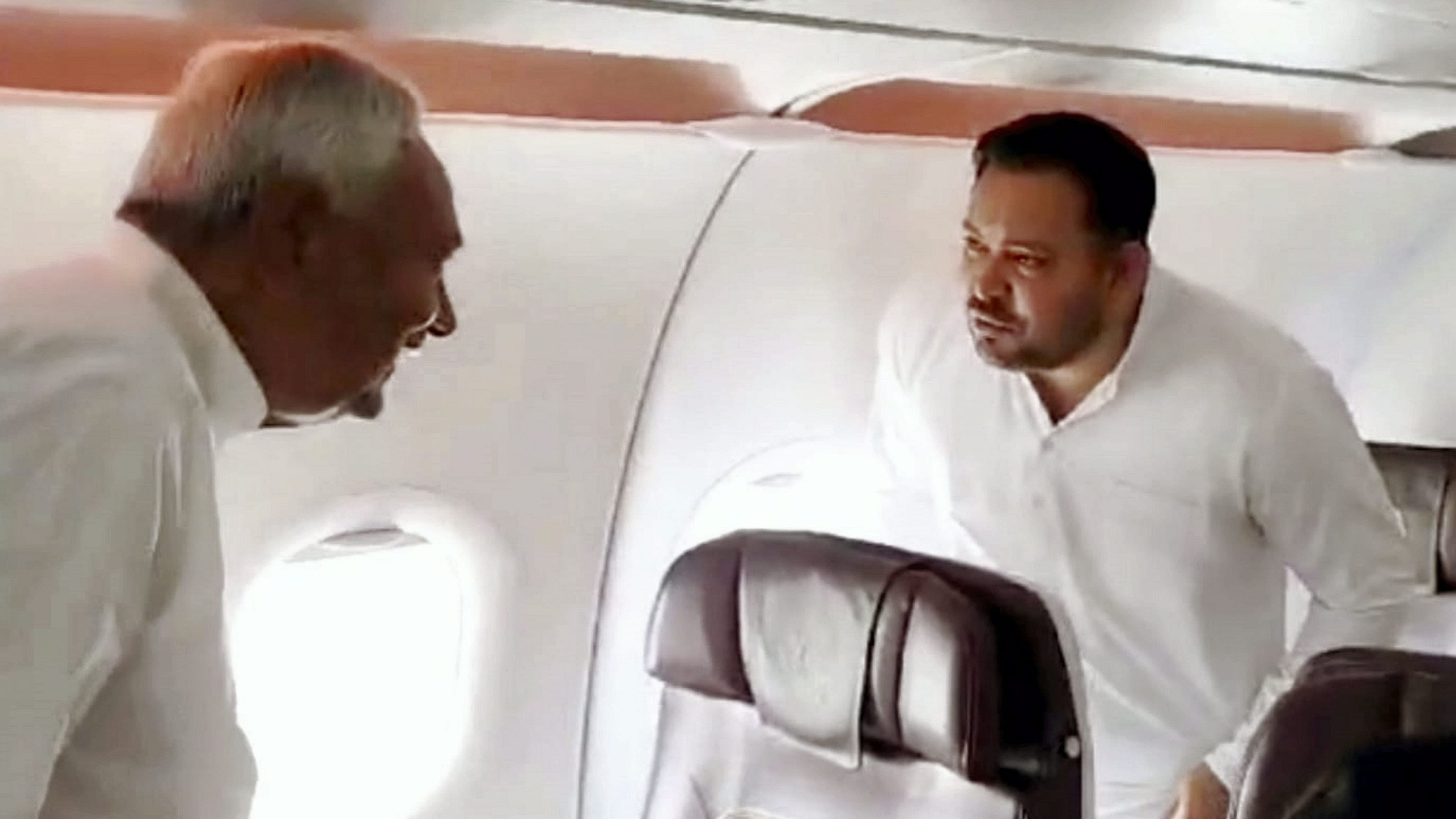 <div class="paragraphs"><p>Bihar Chief Minister Nitish Kumar aboard a flight and RJD leader Tejashwi Yadav.</p></div>