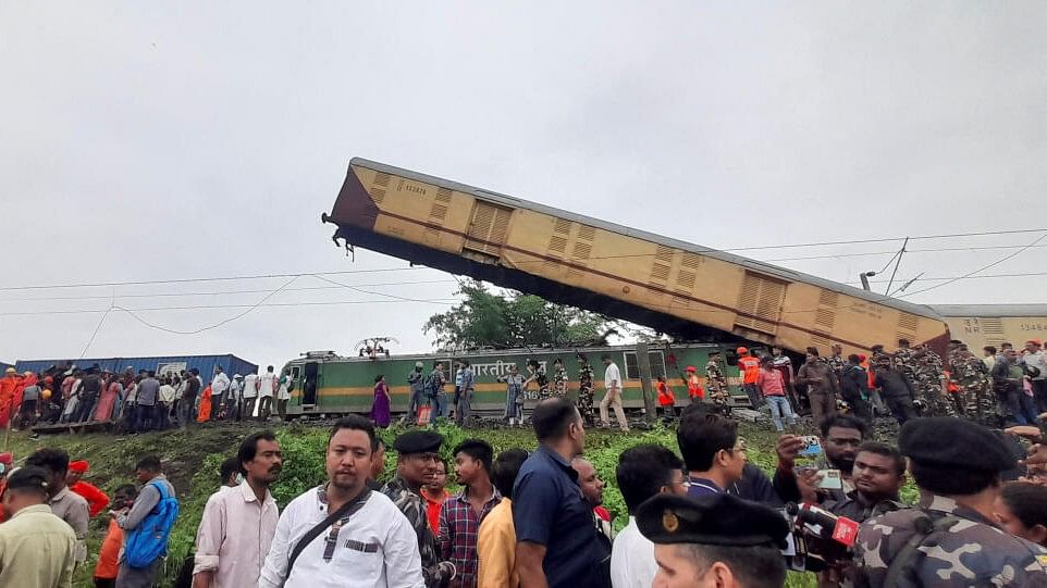 <div class="paragraphs"><p>Rescue workers along with people gather at the site of a train collision, following the accident in Darjeeling district.</p></div>