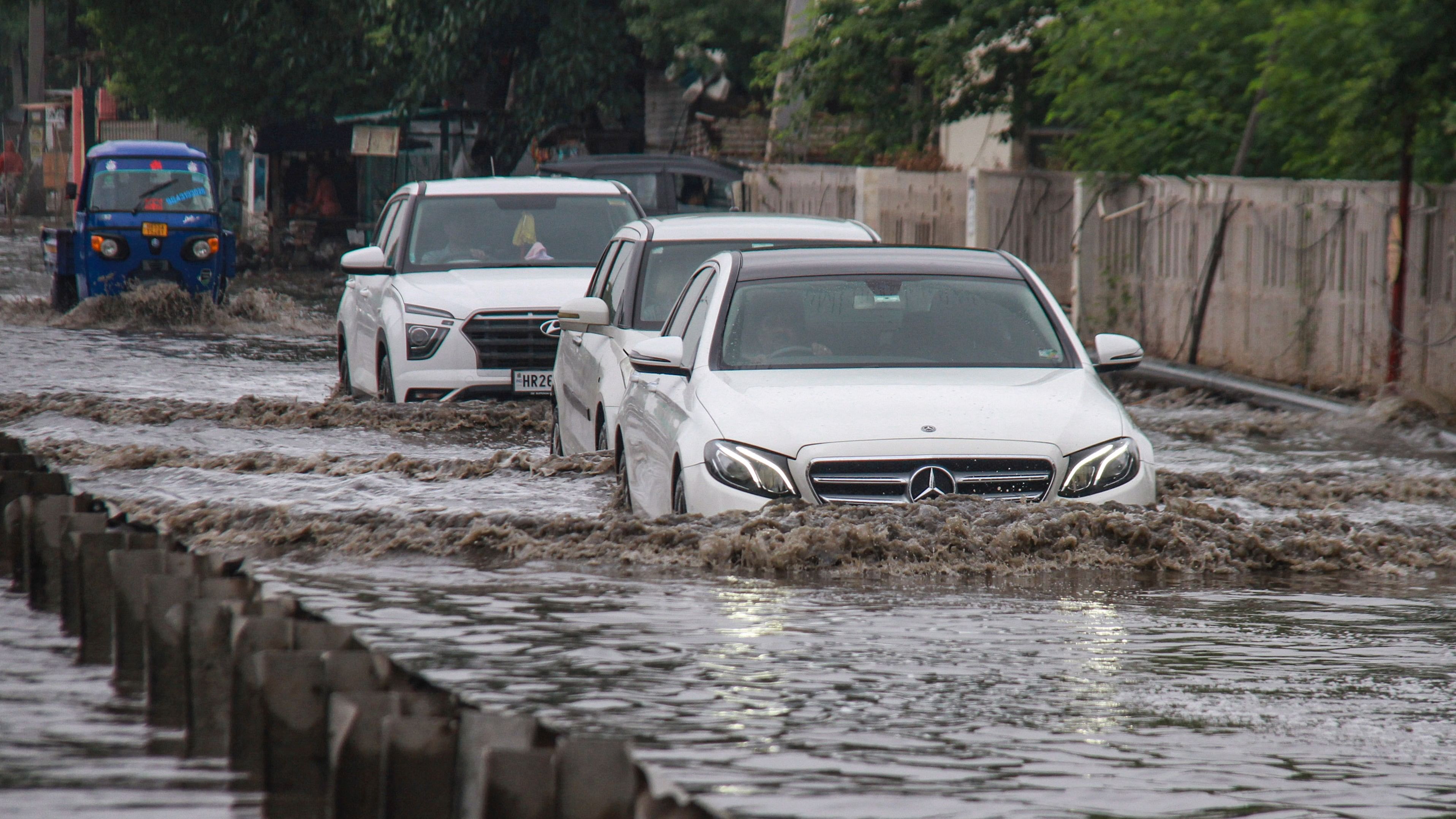 <div class="paragraphs"><p>Vehicles move through waterlogged Delhi-Gurugram Expressway service road after heavy rains, in Gurugram, Friday, June 28, 2024.</p></div>