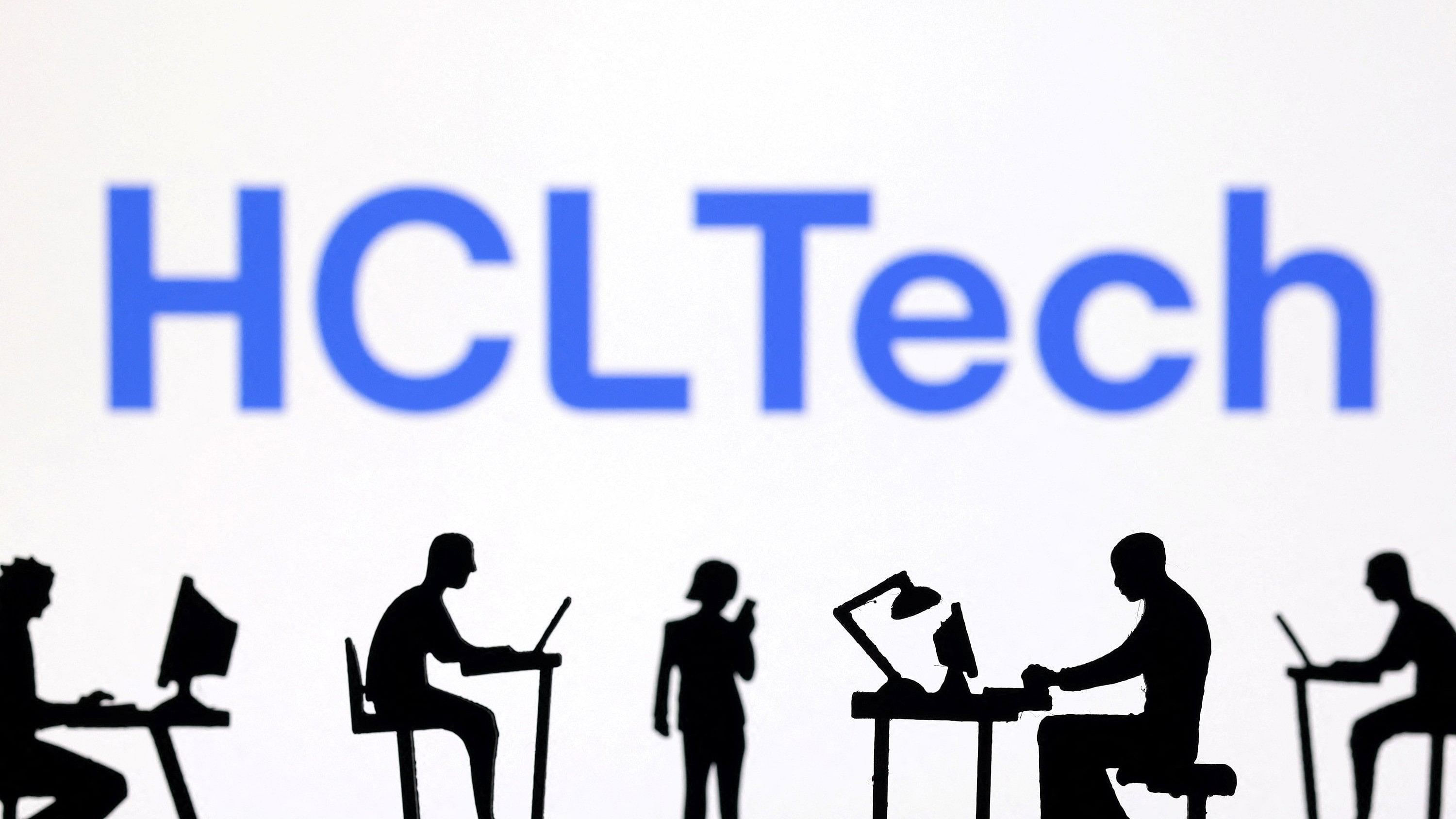 <div class="paragraphs"><p>Figurines with computers and smartphones are seen in front of HCLTech logo in this illustration.</p></div>