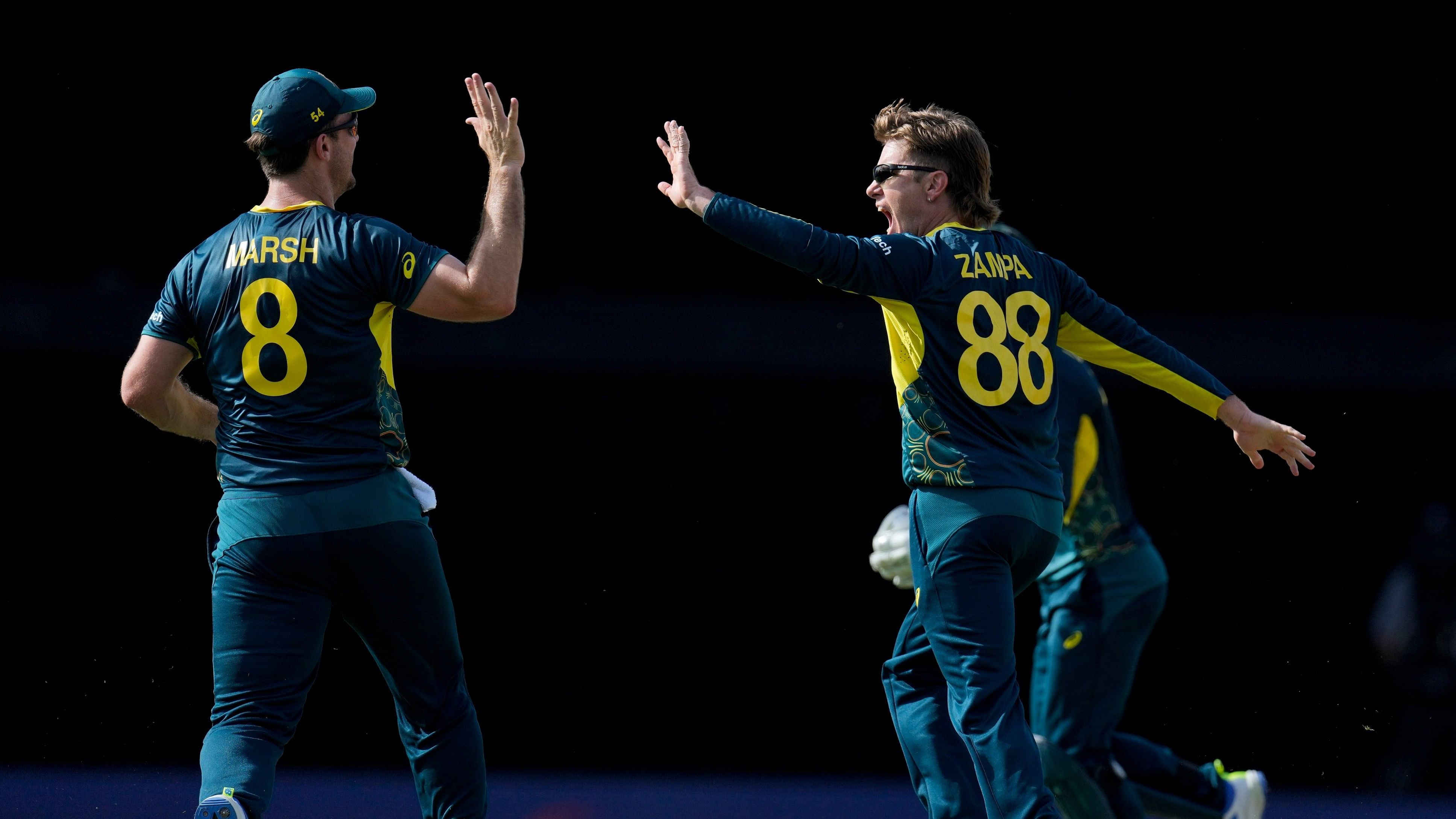 <div class="paragraphs"><p>Australia's Adam Zampa celebrates with captain Mitchell Marsh.</p></div>